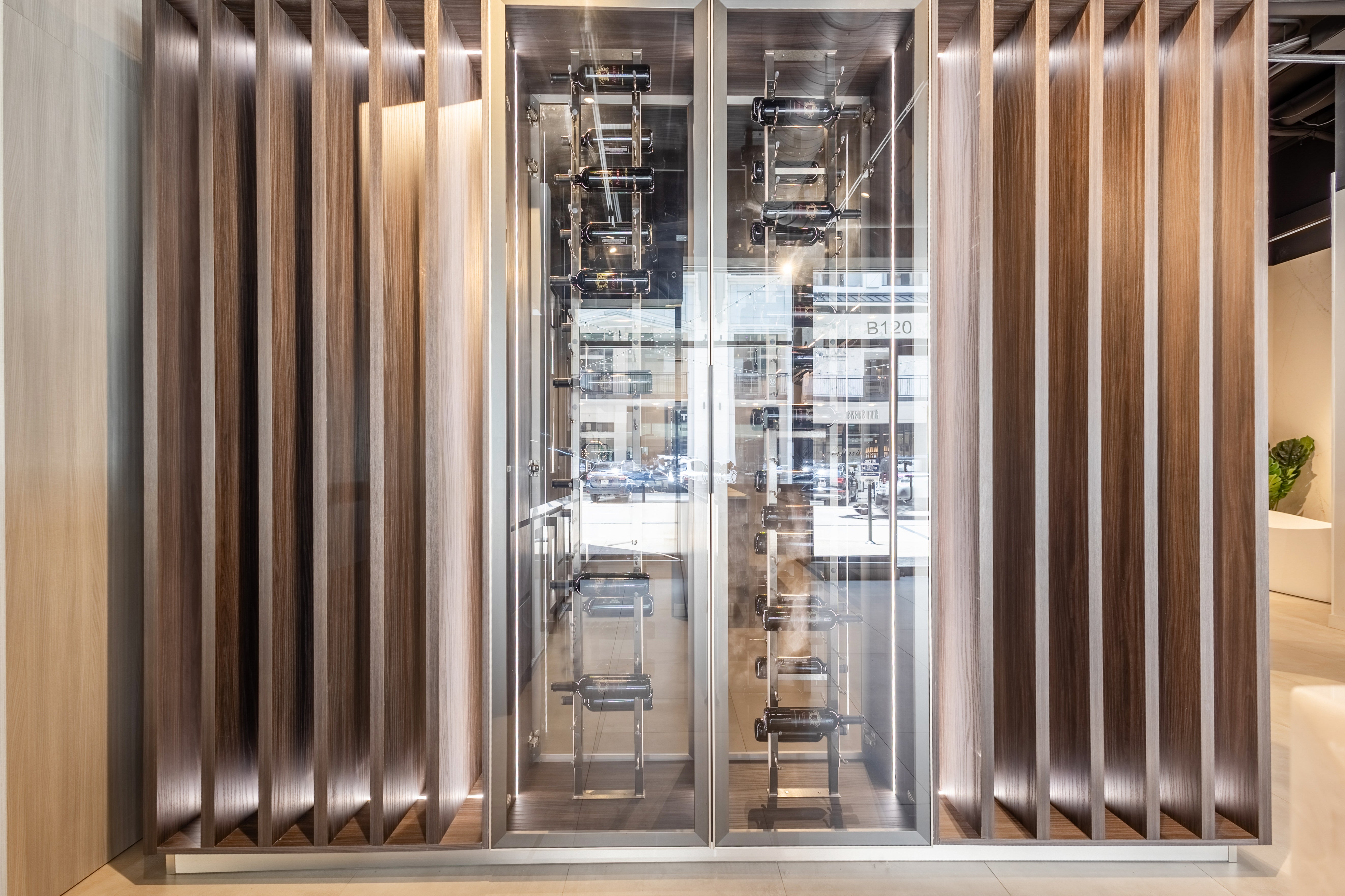 Azzurri Casa Modern Wood Paneled Wet Wine Bar with Wine Wall and Onyx Countertops