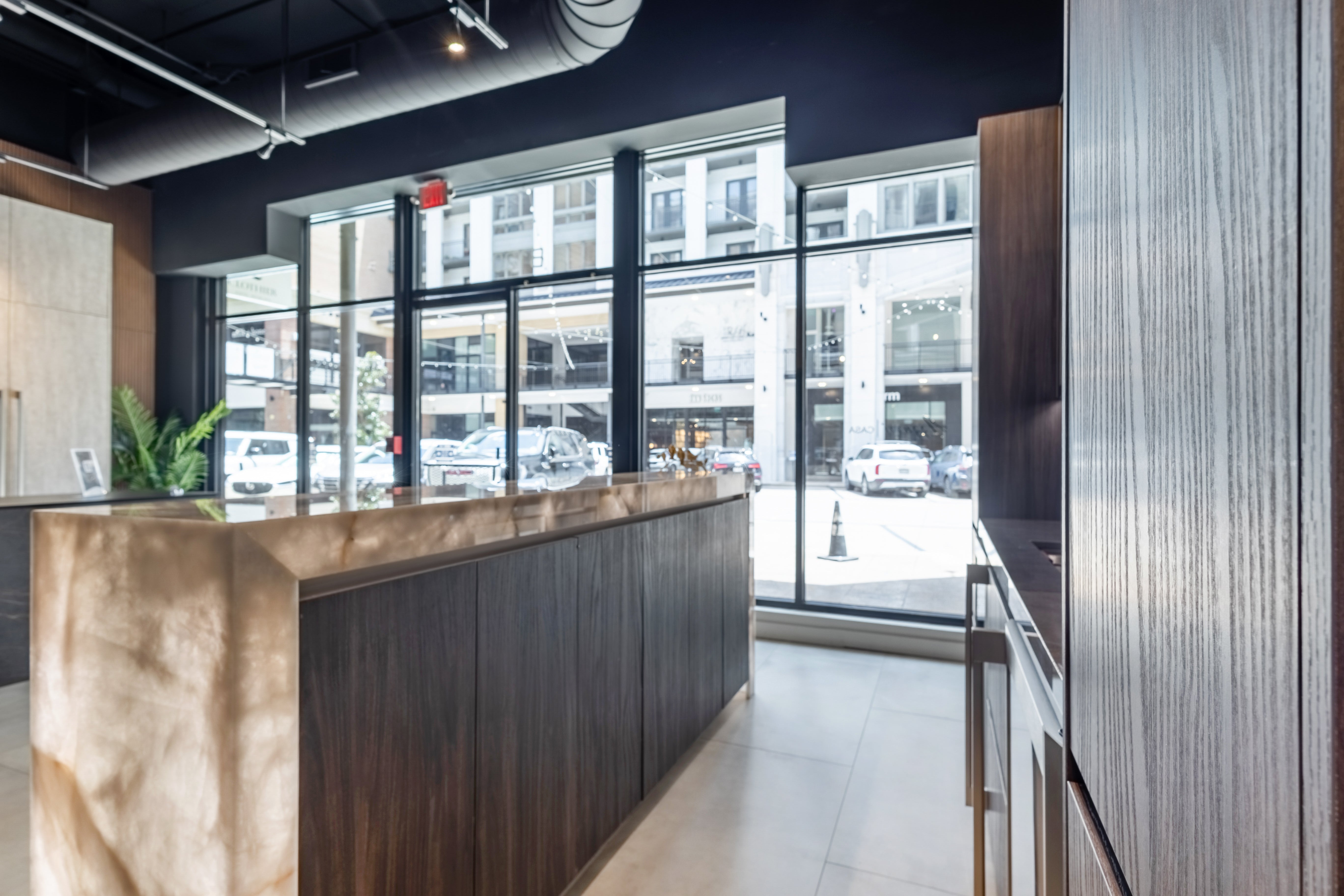 Azzurri Casa Modern Wood Paneled Wet Wine Bar with Wine Wall and Onyx Countertops