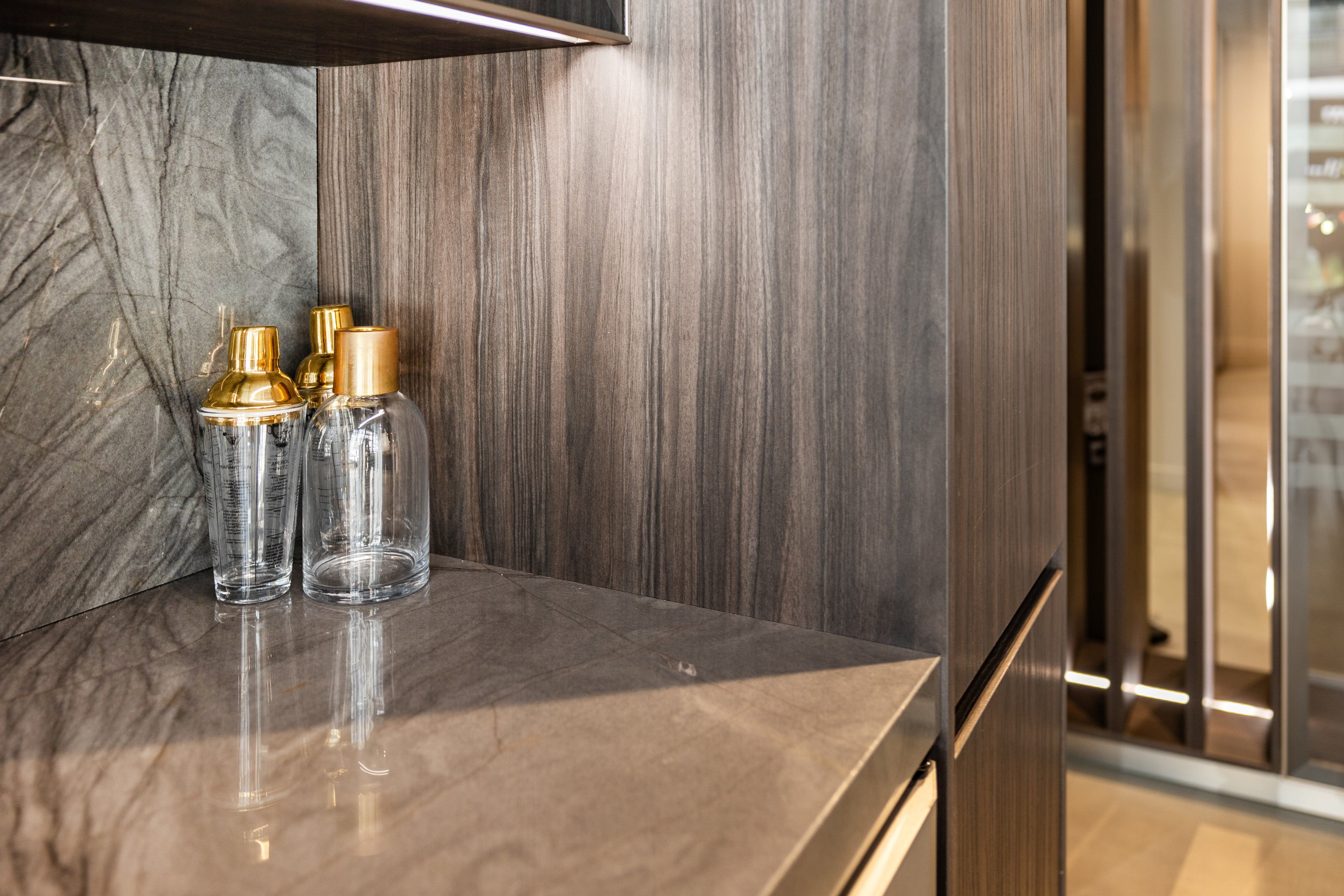 Azzurri Casa Modern Wood Paneled Wet Wine Bar with Wine Wall and Onyx Countertops