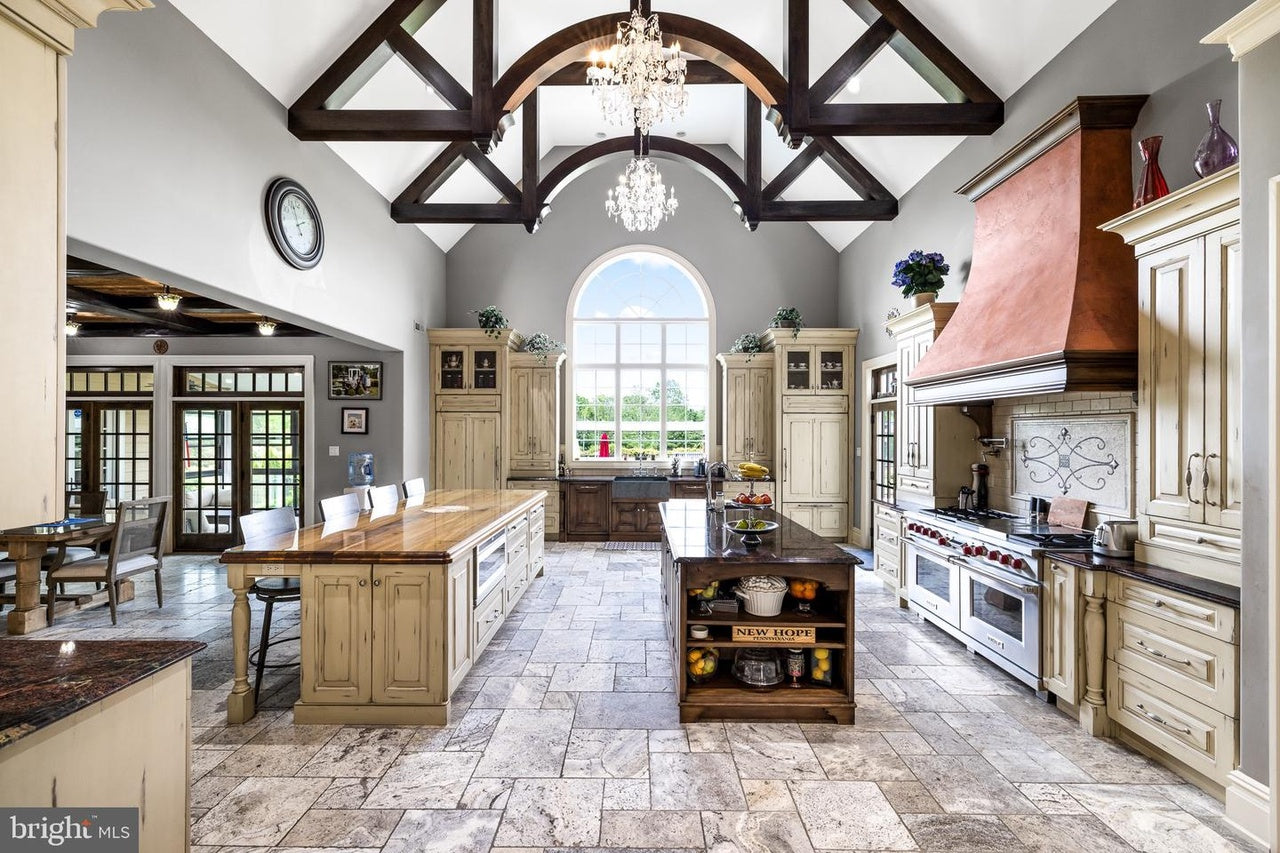 Custom Traditional Distressed Two-Tone Kitchen with Double Island, Stone Countertops and Sub-Zero & Wolf Appliances