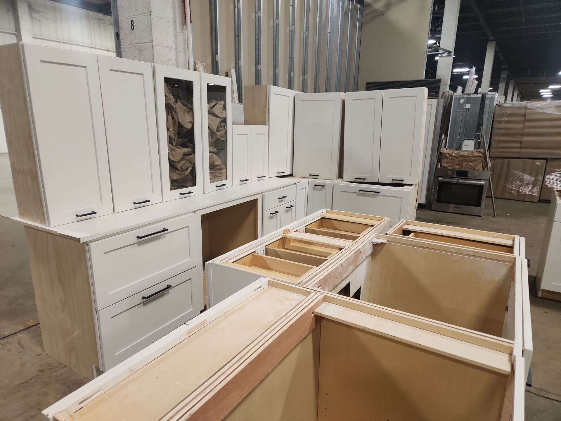 ÒThe WesterlyÓ Transitional White Kitchen with Island, 48" Sub-Zero Refrigerator and Bosch Appliances