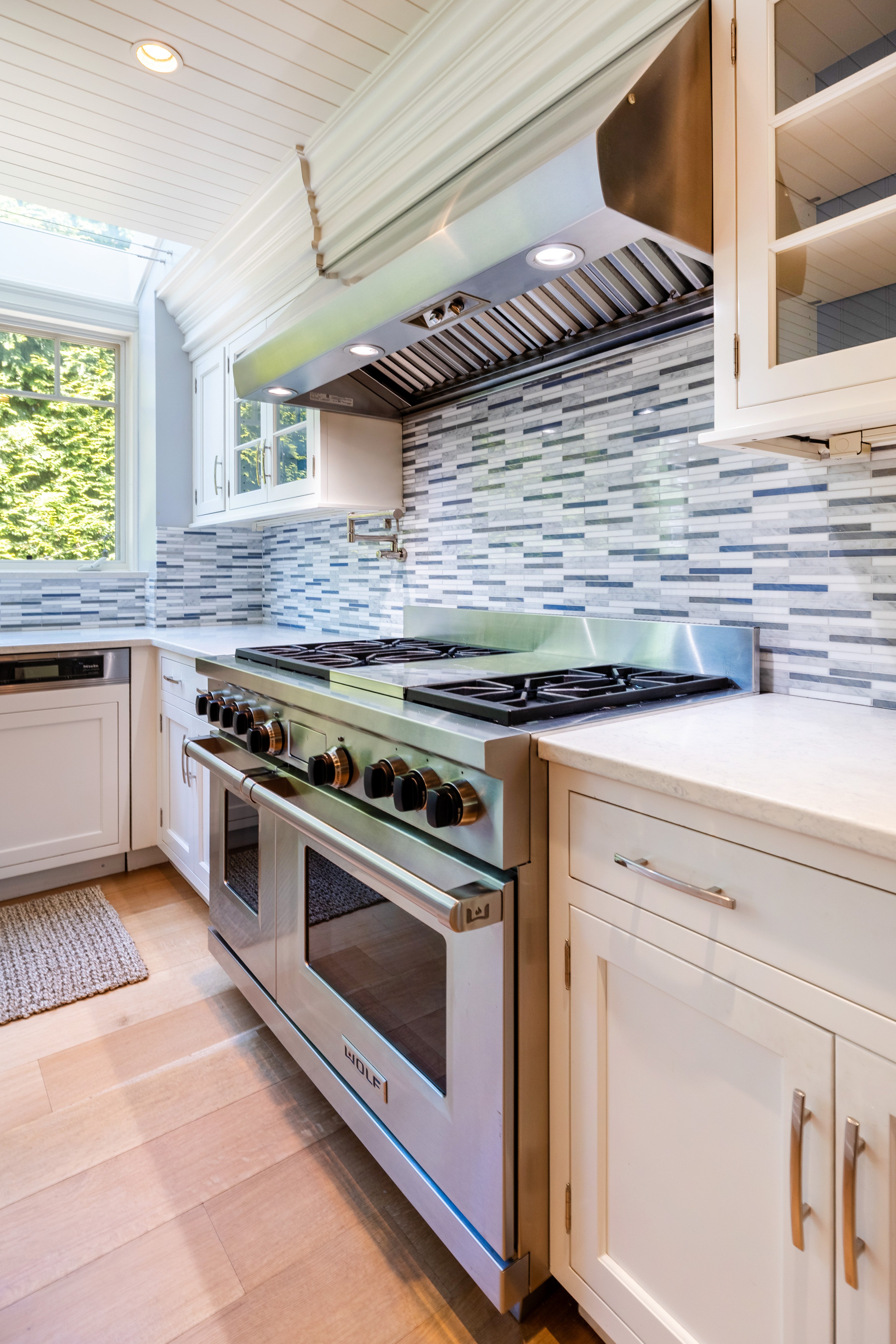 Plain & Fancy Transitional White Kitchen with Island, Countertops and Wolf & Sub-Zero Appliances