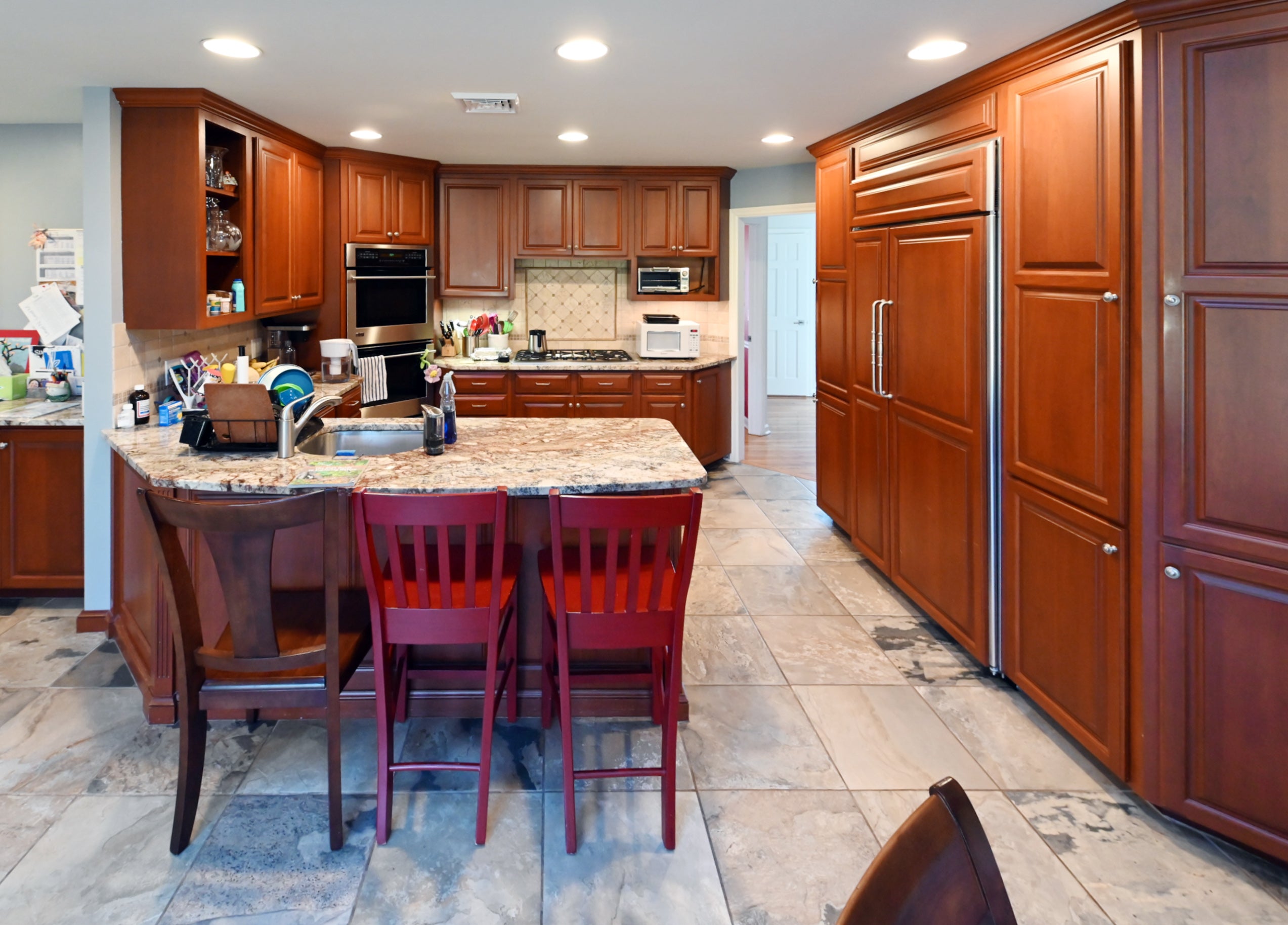 Ackley Cabinet Timeless Cherry & Stainless Traditional Pre-Owned Kitchen