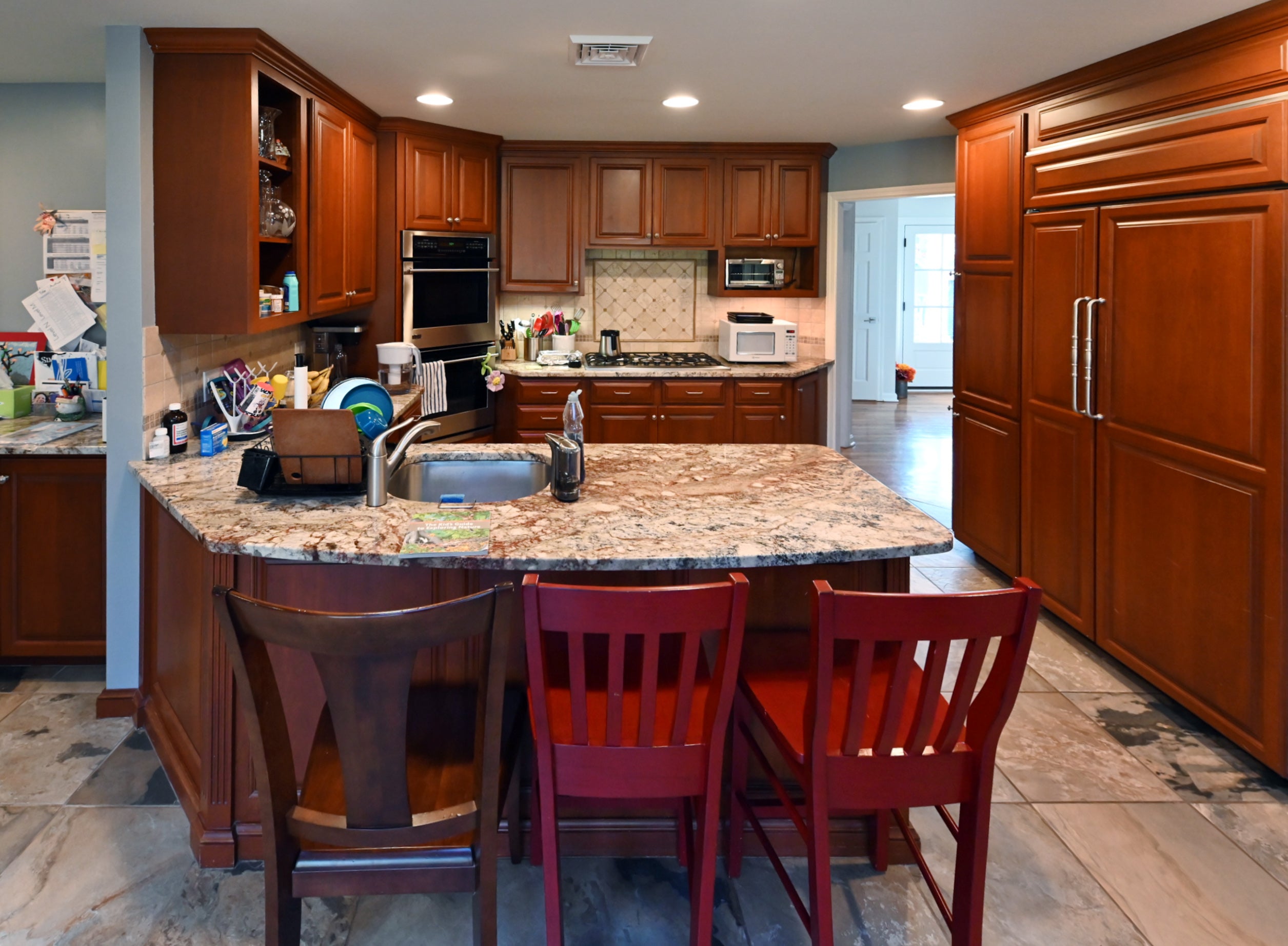 Ackley Cabinet Timeless Cherry & Stainless Traditional Pre-Owned Kitchen