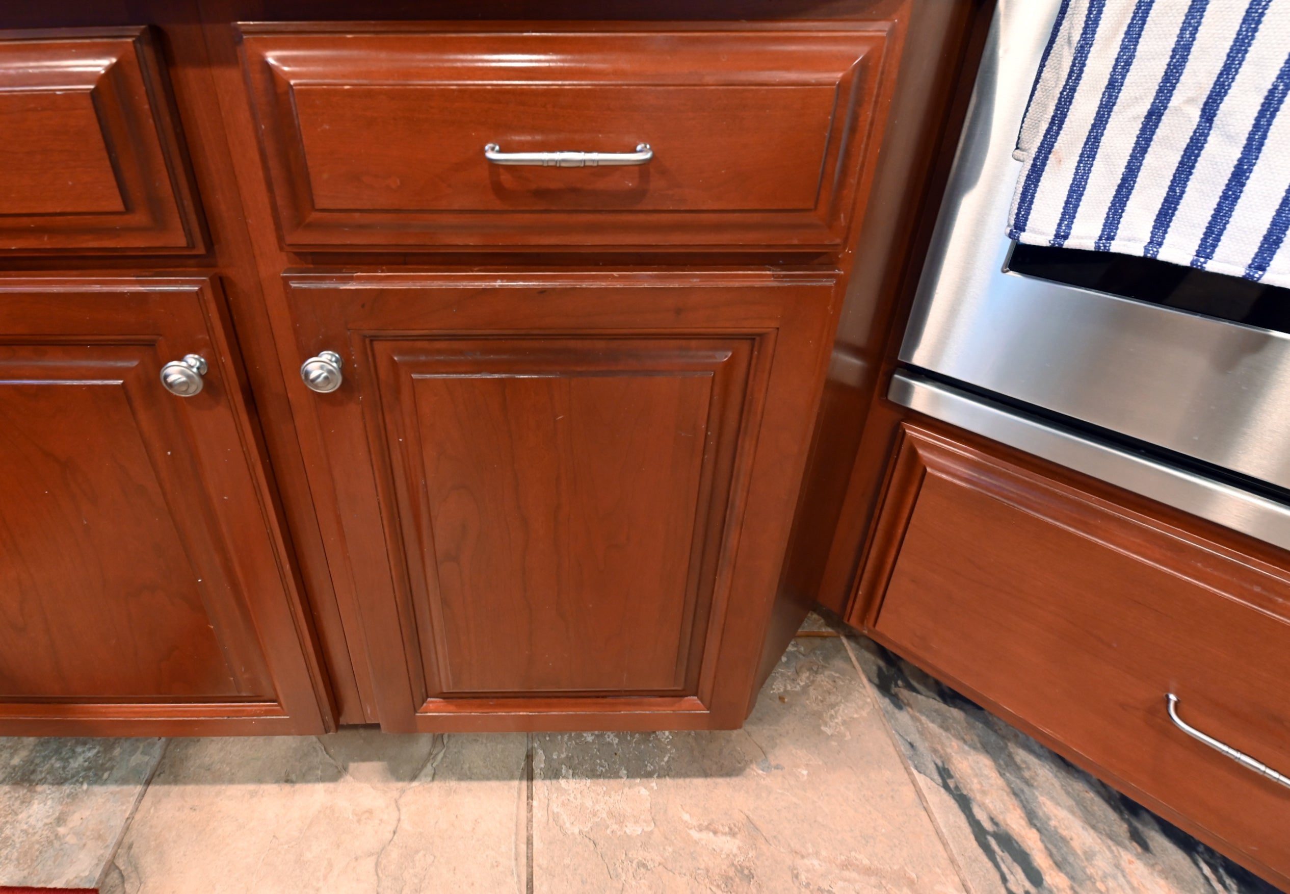 Ackley Cabinet Timeless Cherry & Stainless Traditional Pre-Owned Kitchen