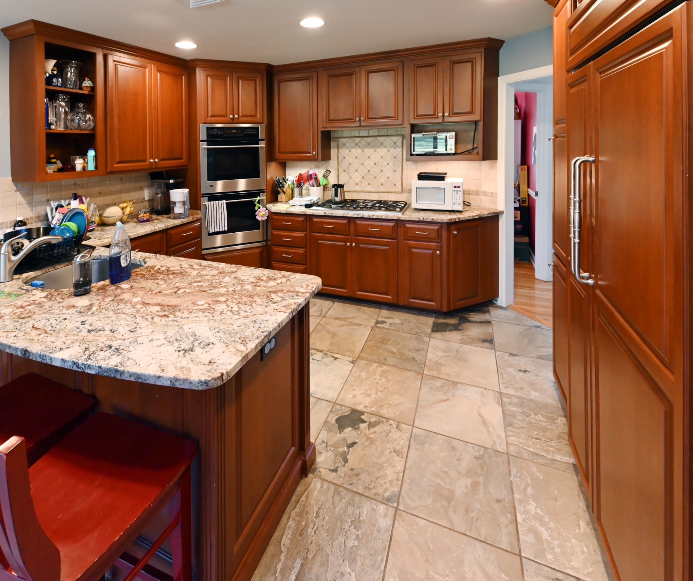 Ackley Cabinet Timeless Cherry & Stainless Traditional Pre-Owned Kitchen