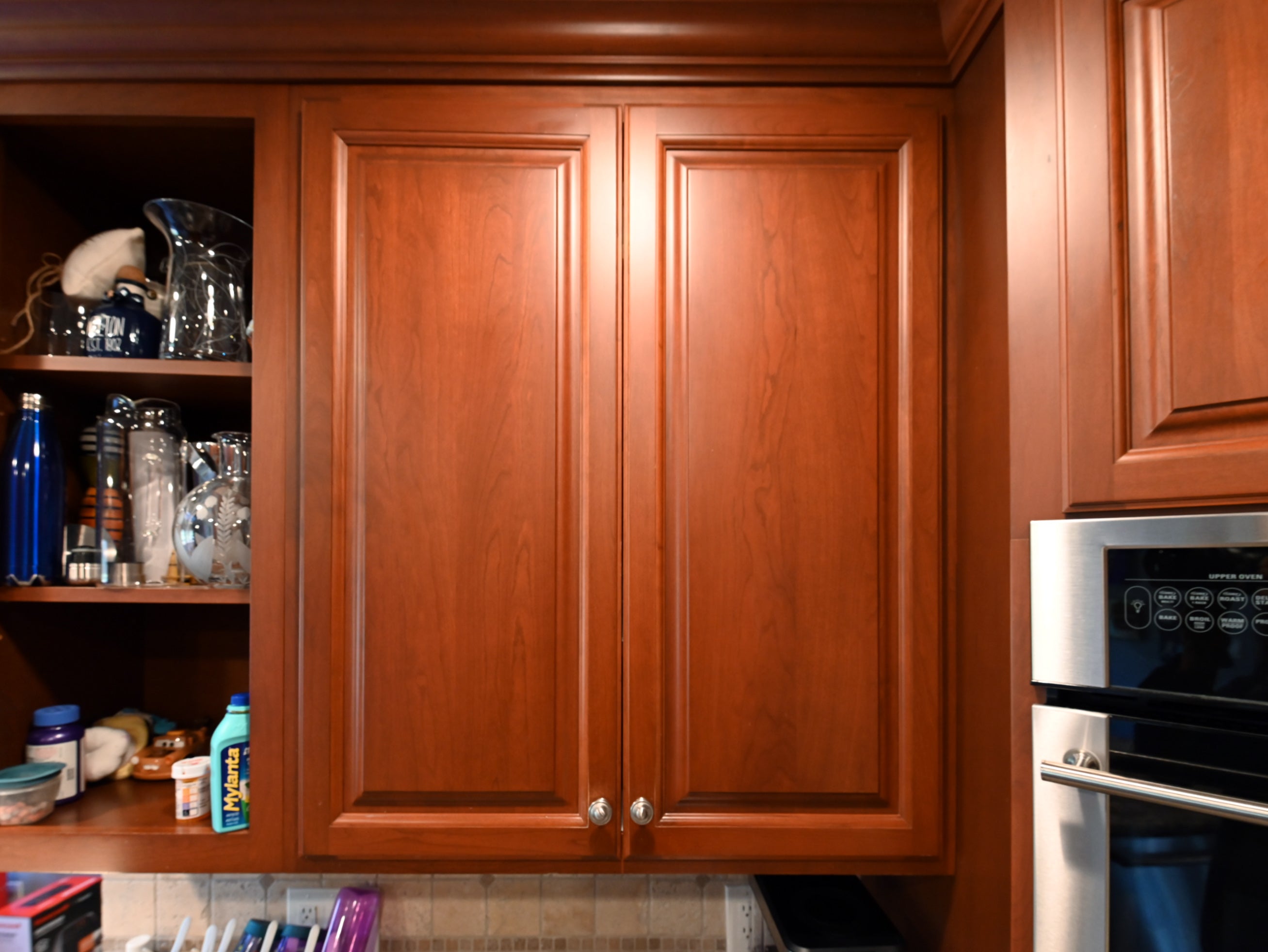 Ackley Cabinet Timeless Cherry & Stainless Traditional Pre-Owned Kitchen