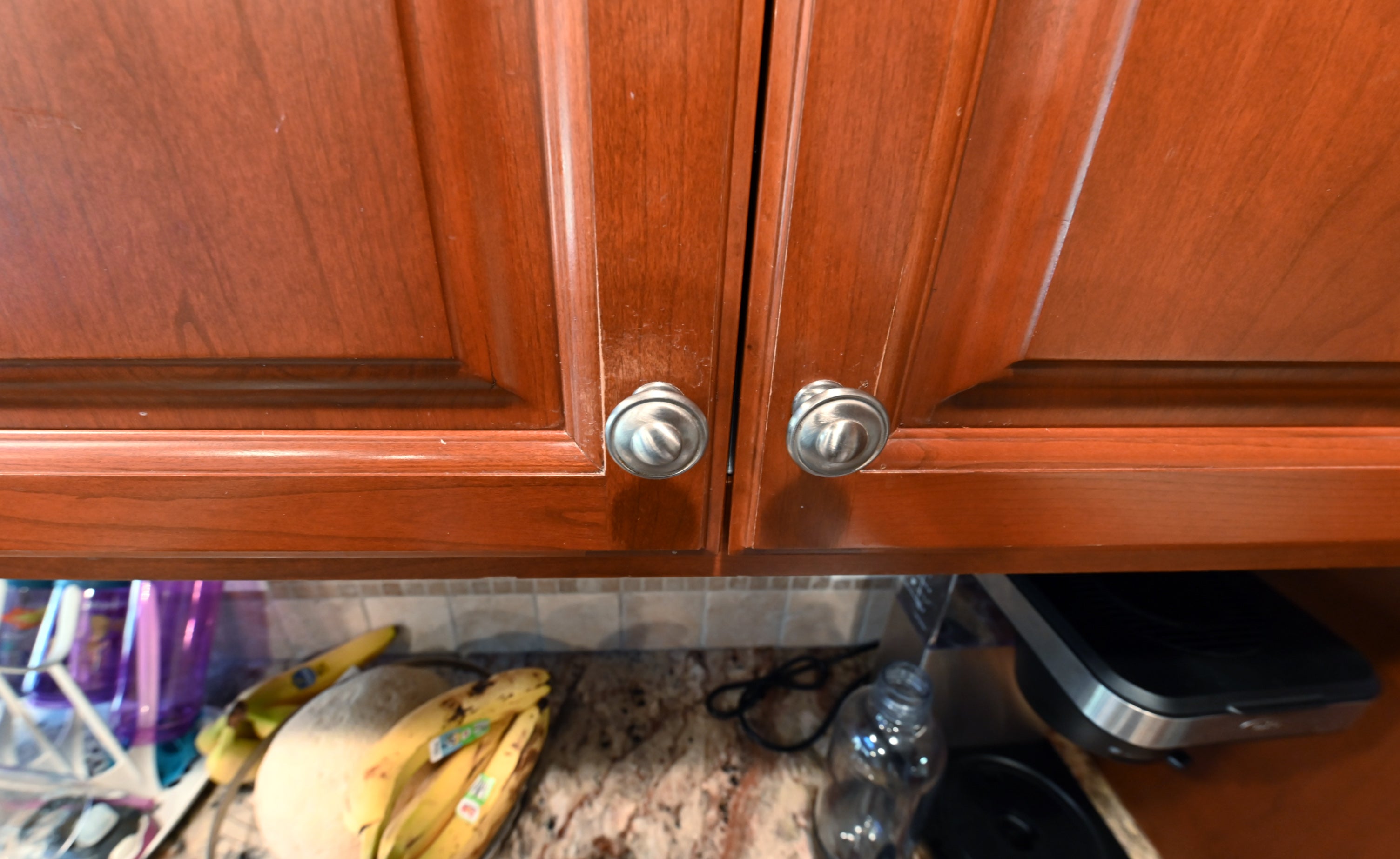 Ackley Cabinet Timeless Cherry & Stainless Traditional Pre-Owned Kitchen
