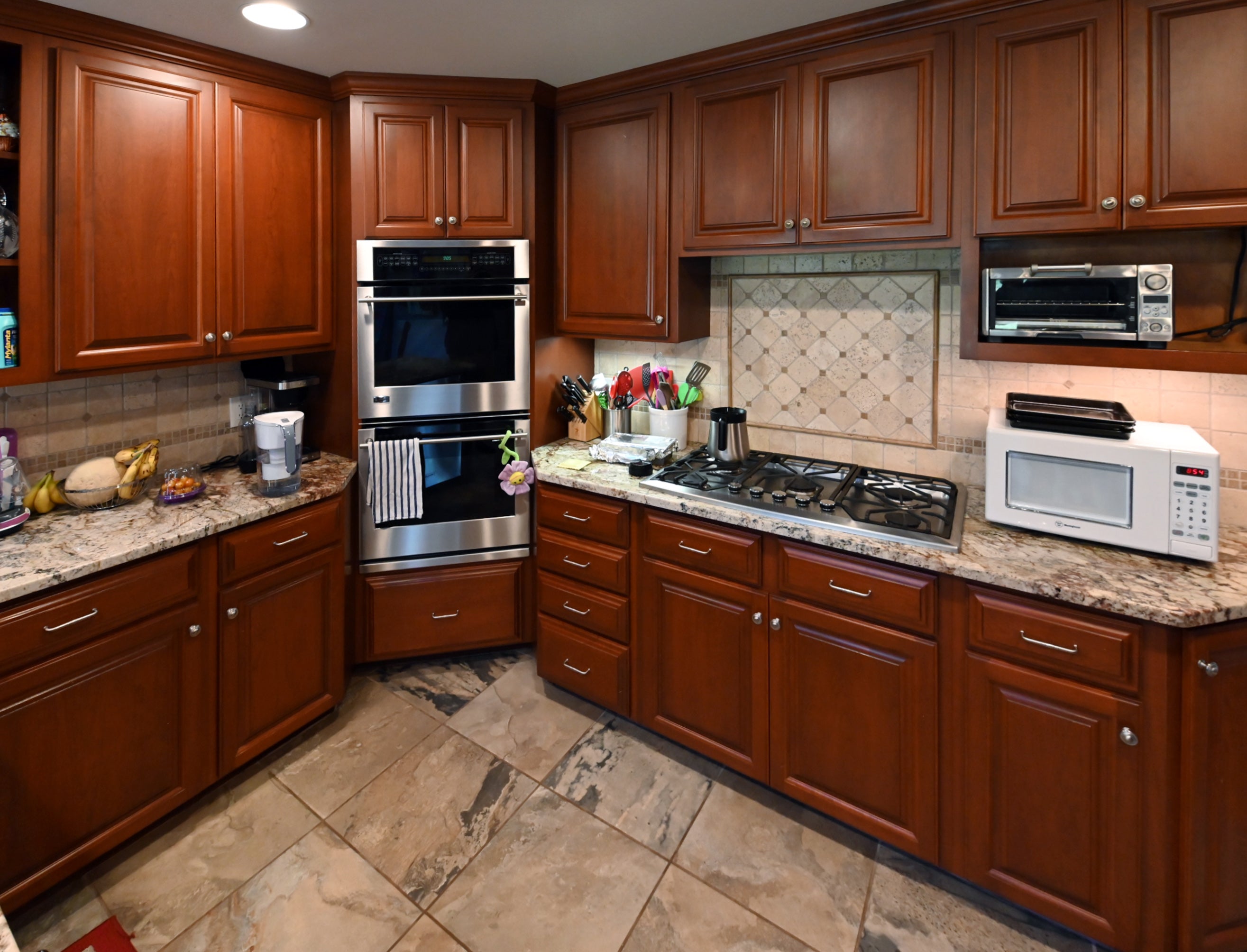 Ackley Cabinet Timeless Cherry & Stainless Traditional Pre-Owned Kitchen