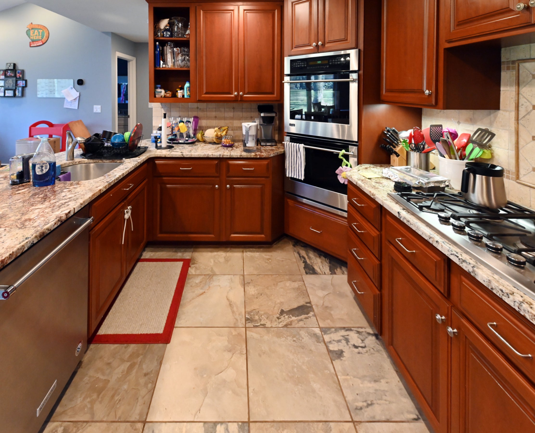 Ackley Cabinet Timeless Cherry & Stainless Traditional Pre-Owned Kitchen