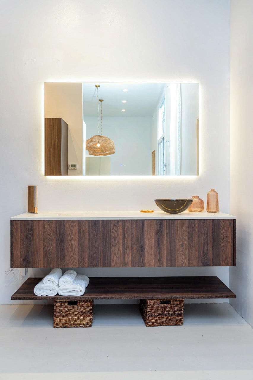 Poggenpohl modern smoked oak vertical grain floating vanity with matching framed mirror front view