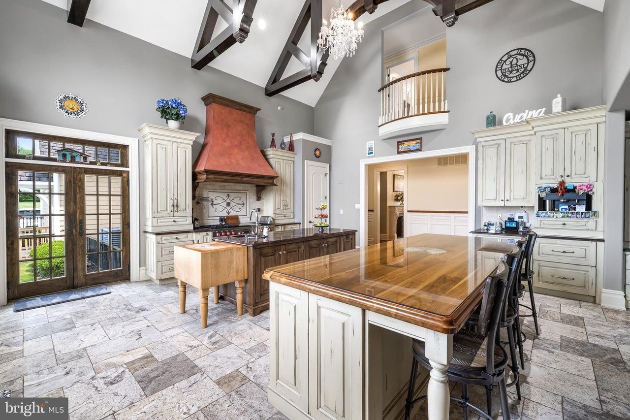 Custom Traditional Distressed Two-Tone Kitchen with Double Island, Stone Countertops and Sub-Zero & Wolf Appliances