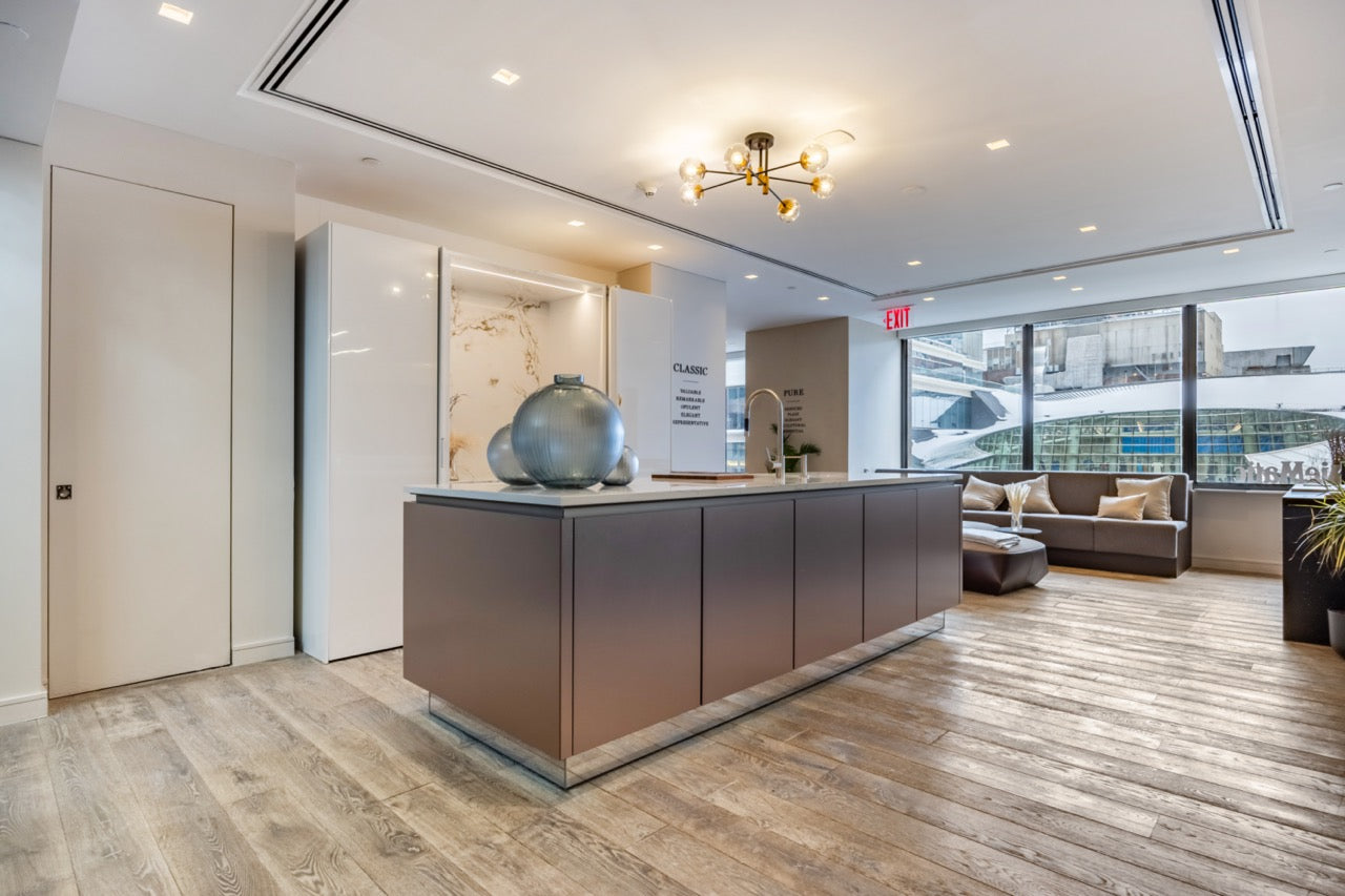 SieMatic Modern Rose Gold Handleless Island with Lotus White Hideaway Pantry with Pocket Doors