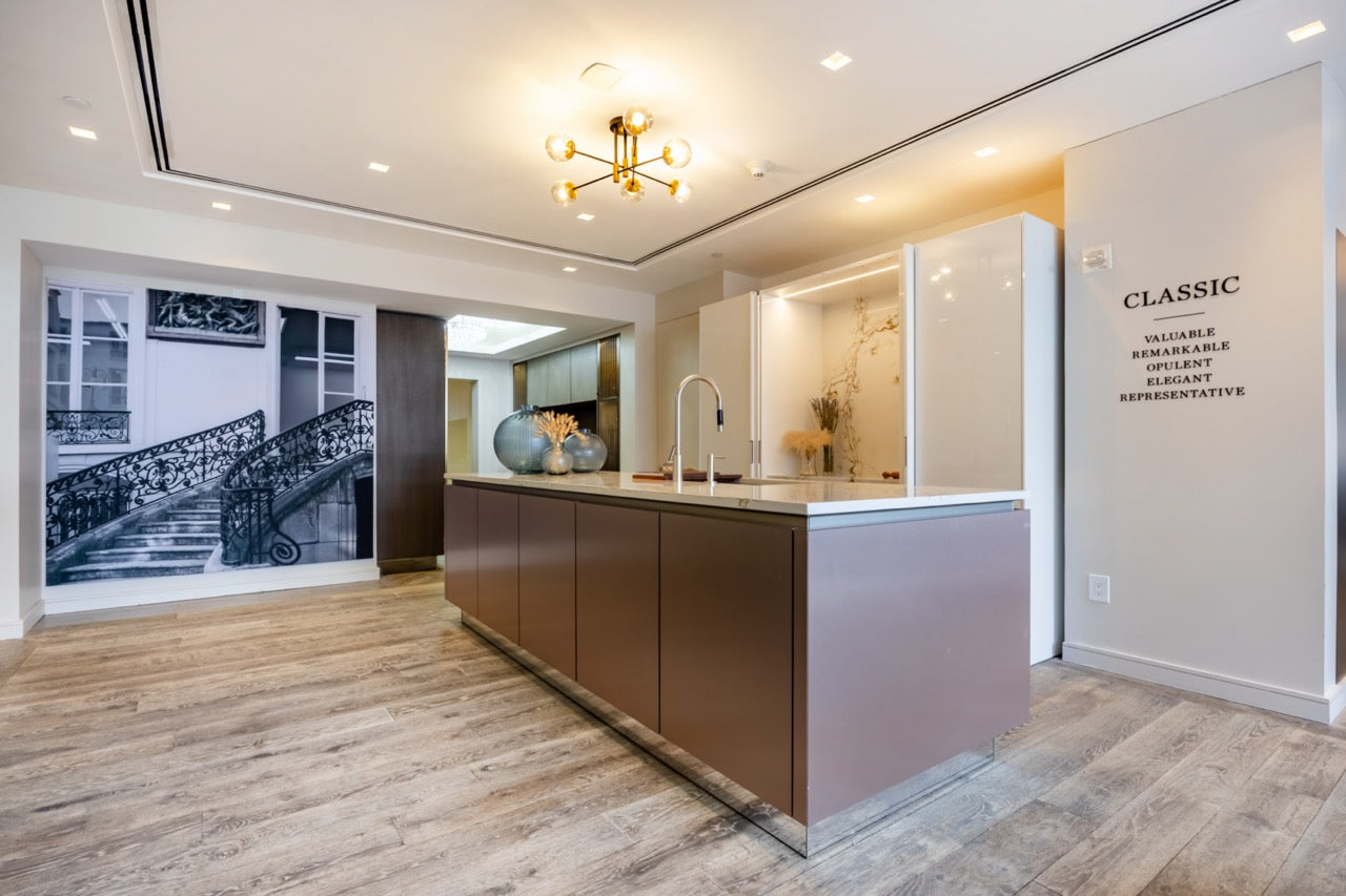 SieMatic Modern Rose Gold Handleless Island with Lotus White Hideaway Pantry with Pocket Doors