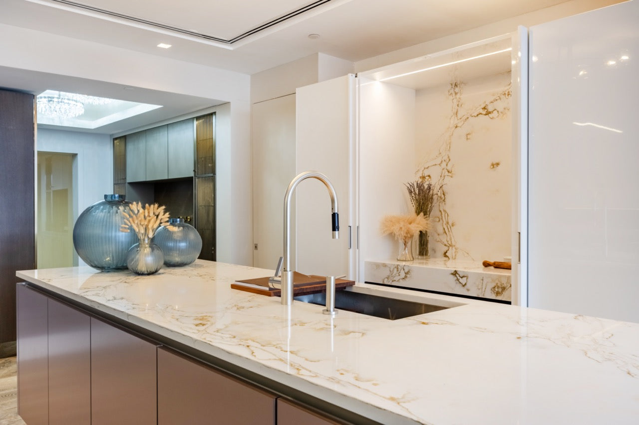 SieMatic S2 Modern Rose Gold Handleless Island with Lotus White Hideaway Pantry