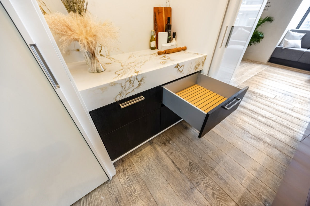 SieMatic S2 Modern Rose Gold Handleless Island with Lotus White Hideaway Pantry