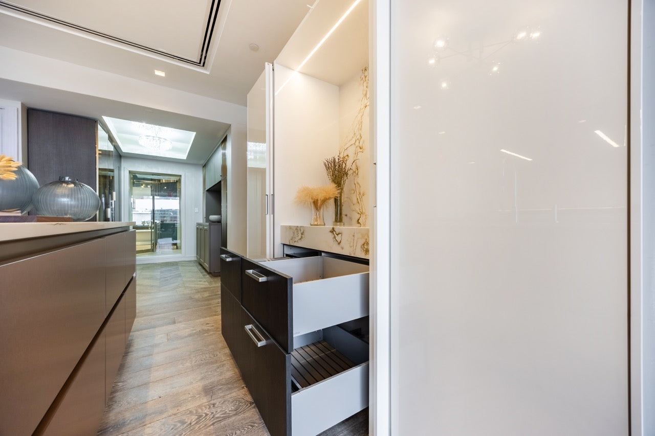 SieMatic S2 Modern Rose Gold Handleless Island with Lotus White Hideaway Pantry