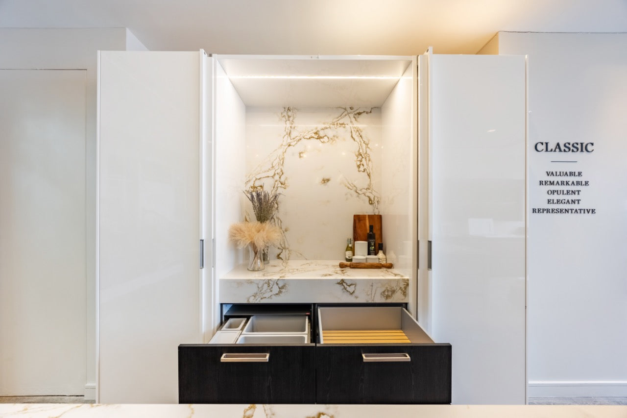 SieMatic S2 Modern Rose Gold Handleless Island with Lotus White Hideaway Pantry