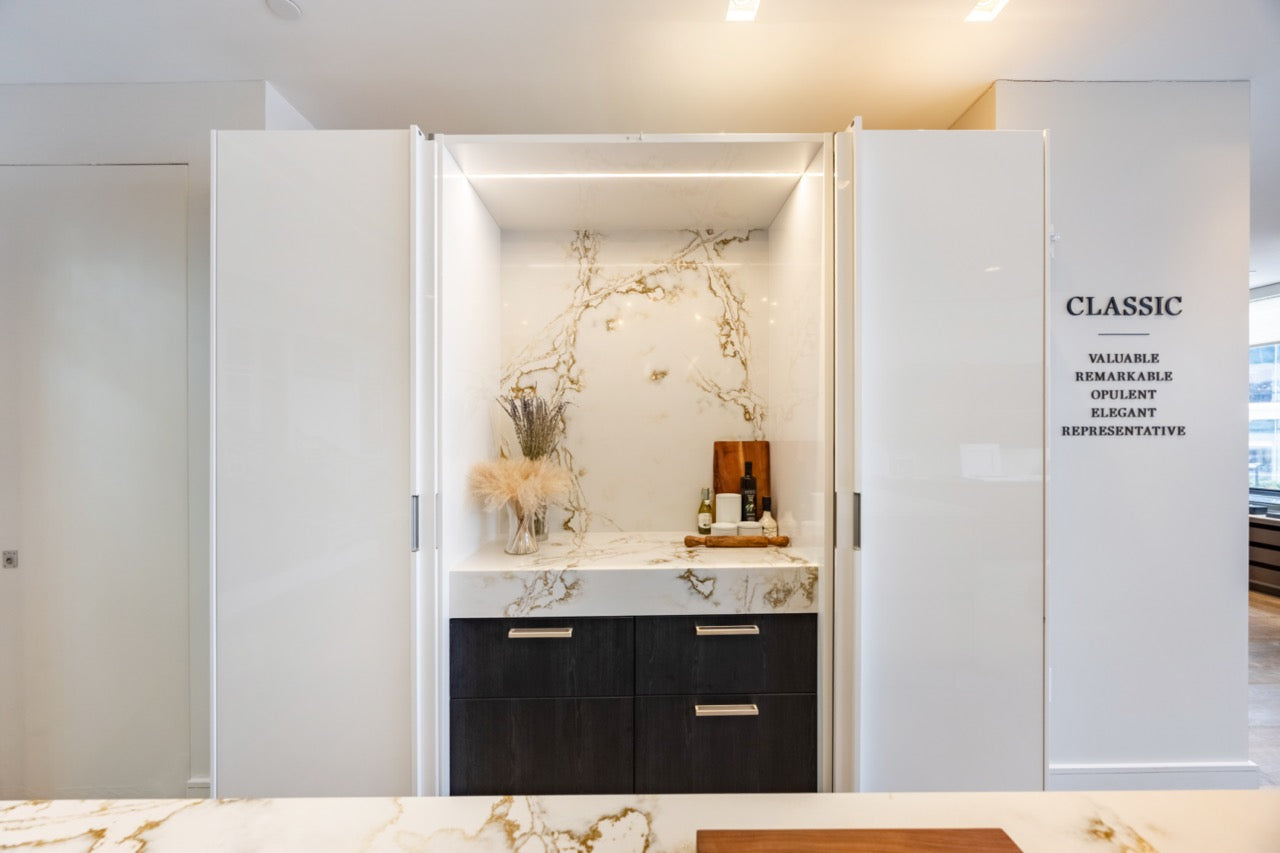 SieMatic S2 Modern Rose Gold Handleless Island with Lotus White Hideaway Pantry