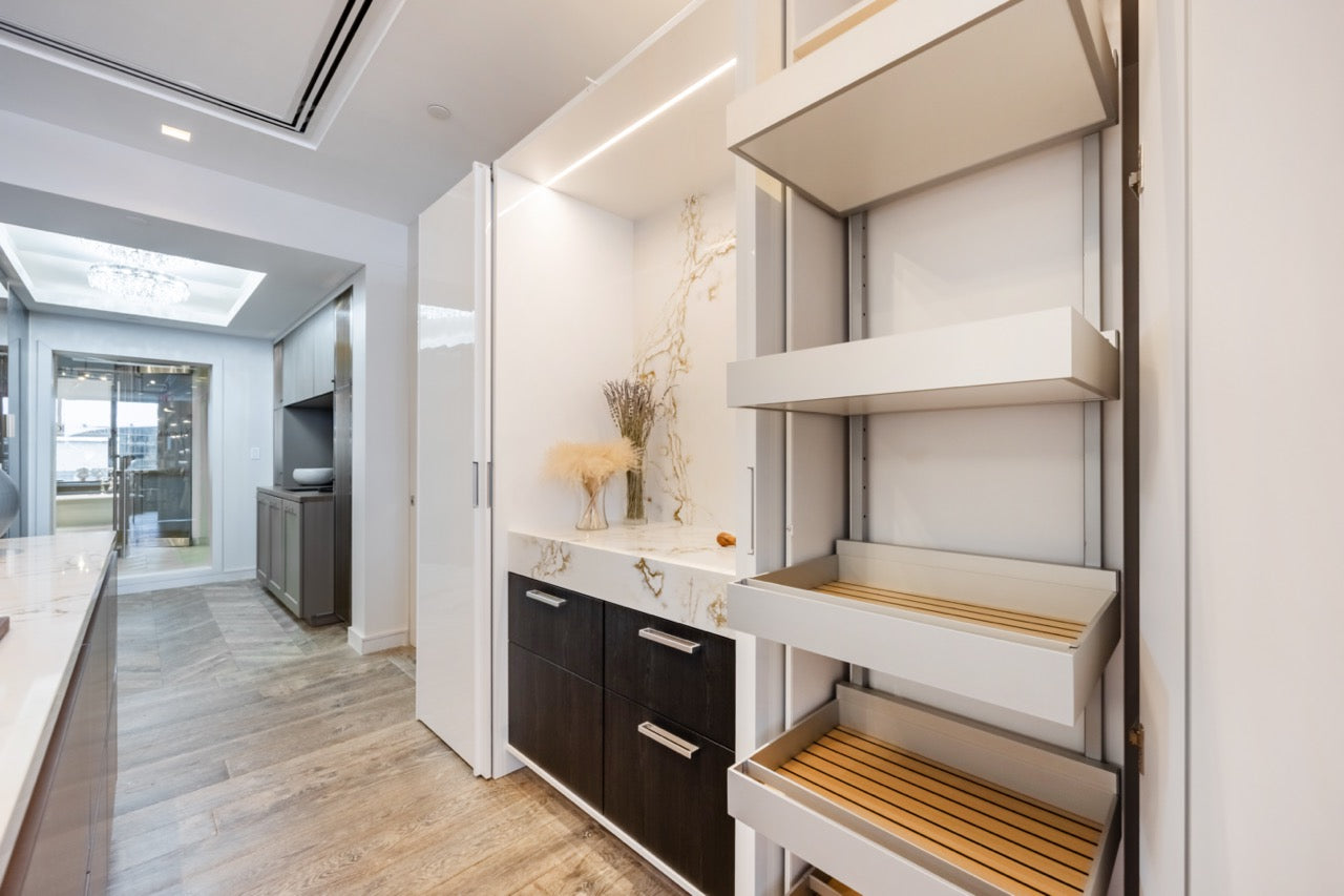 SieMatic Modern Rose Gold Handleless Island with Lotus White Hideaway Pantry with Pocket Doors