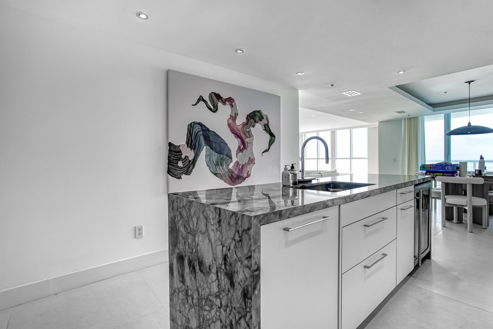 Poggenpohl White Modern Kitchen with Waterfall Island, Marble Countertops and Miele Appliances