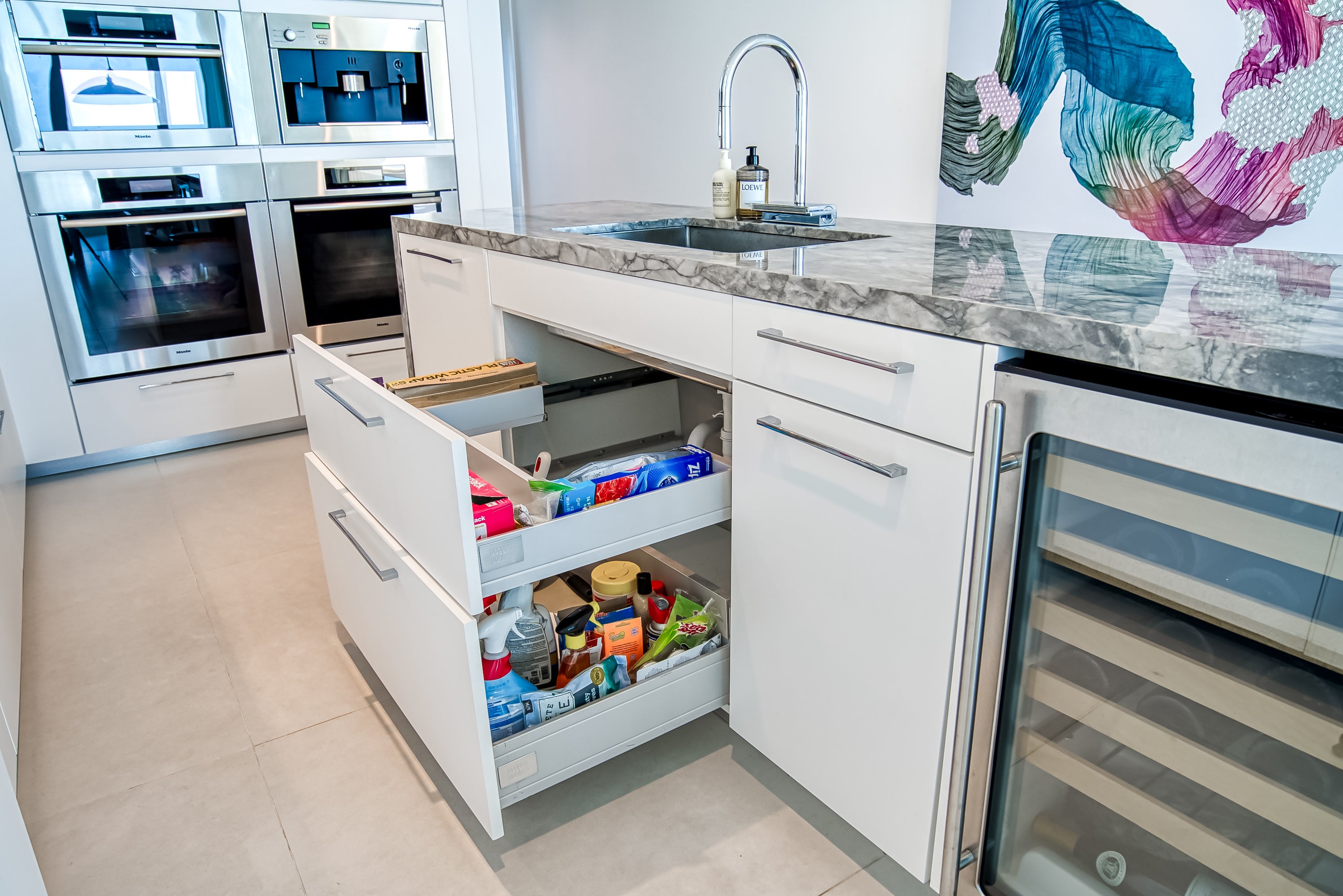 Poggenpohl White Modern Kitchen with Waterfall Island, Marble Countertops and Miele Appliances