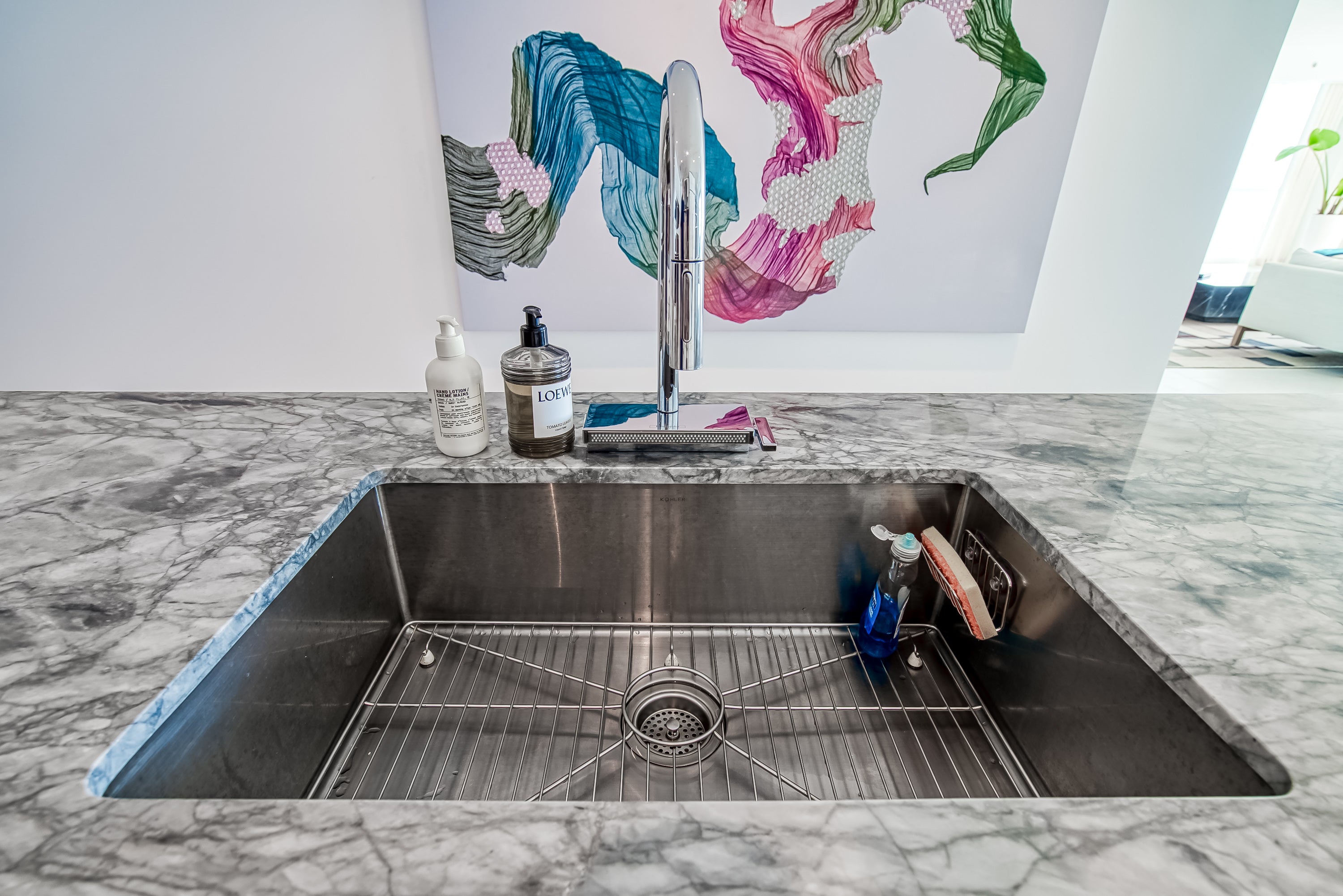 Poggenpohl White Modern Kitchen with Waterfall Island, Marble Countertops and Miele Appliances