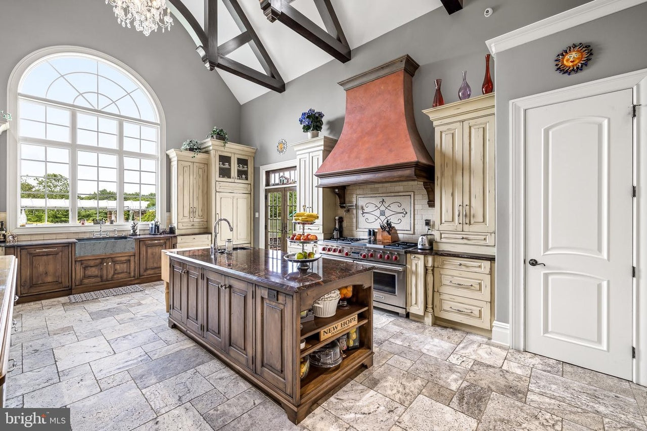 Custom Traditional Distressed Two-Tone Kitchen with Double Island, Stone Countertops and Sub-Zero & Wolf Appliances