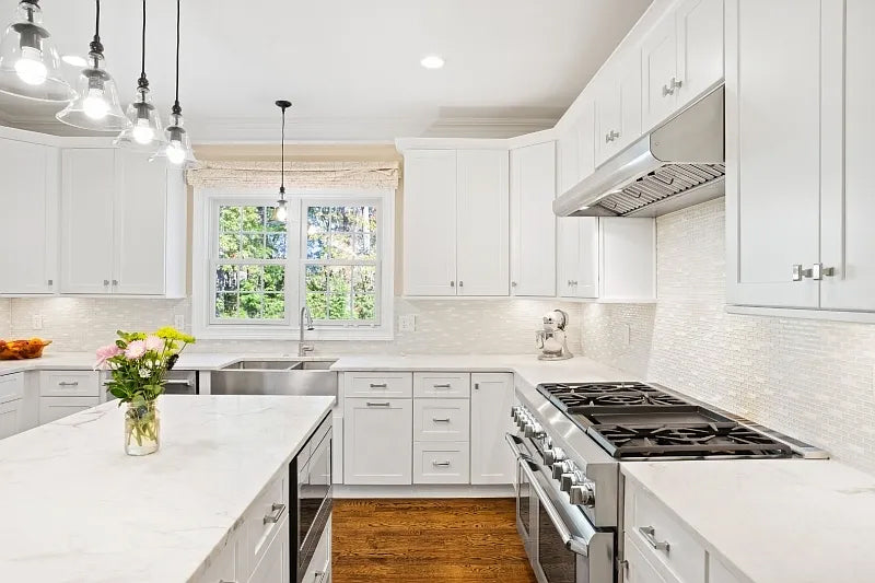 Fabuwood Transitional White Kitchen with Island and White Marble Countertops