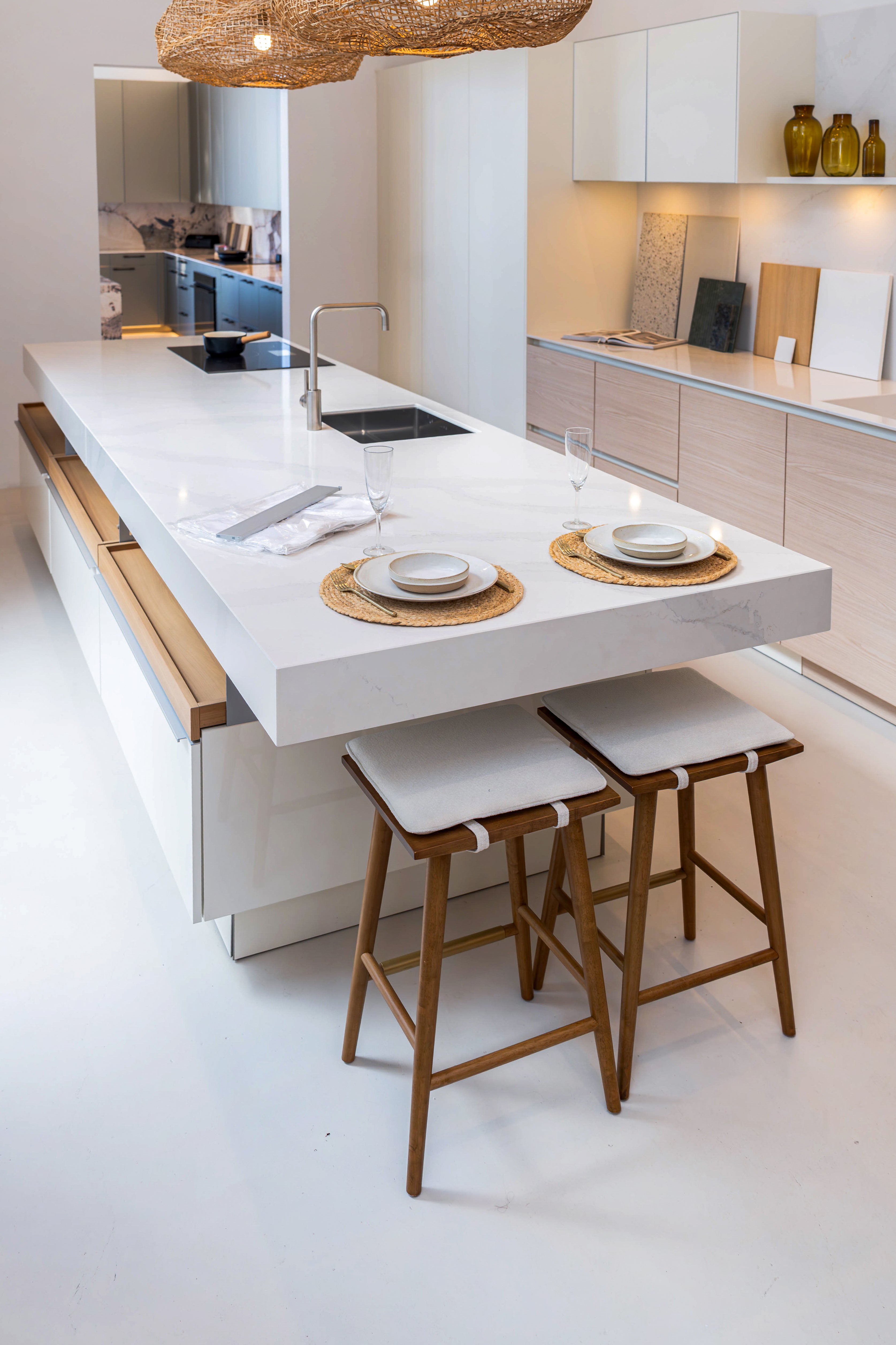 Poggenpohl white gloss island open drawers showing metallic interior soft close glides