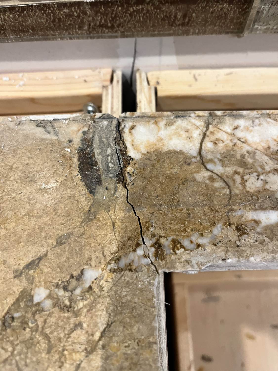 Kraftmaid Transitional Dark Wooden Kitchen with Marble Countertops and GE Monogram Appliances