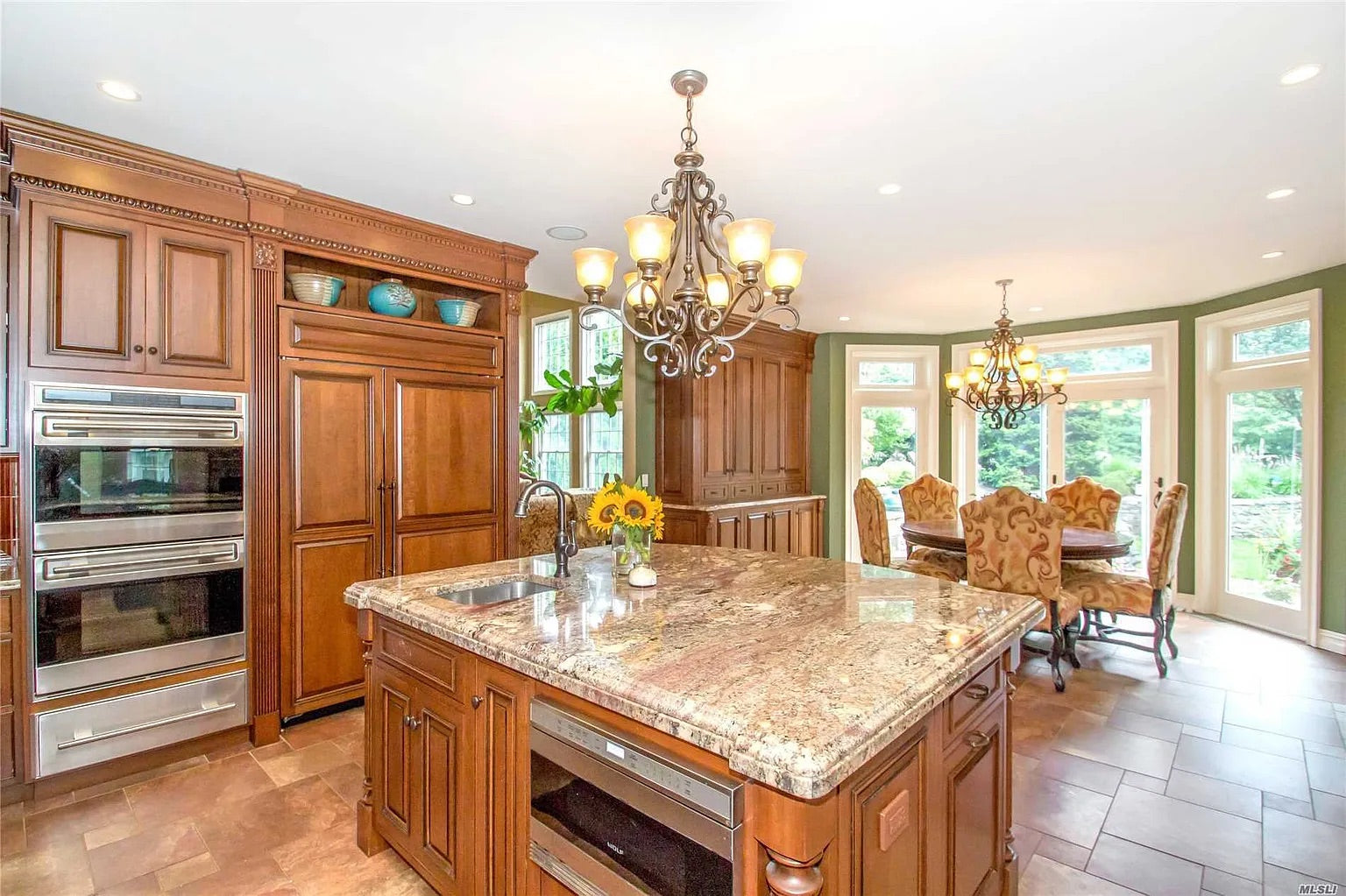 Custom traditional wood butler's pantry with integrated Sub-Zero wine cooler