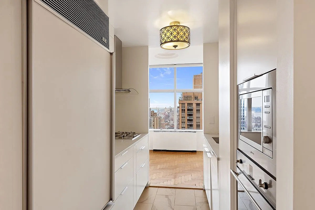 Leicht Modern Off White Kitchenette with Quartz Countertops & Smeg Appliances