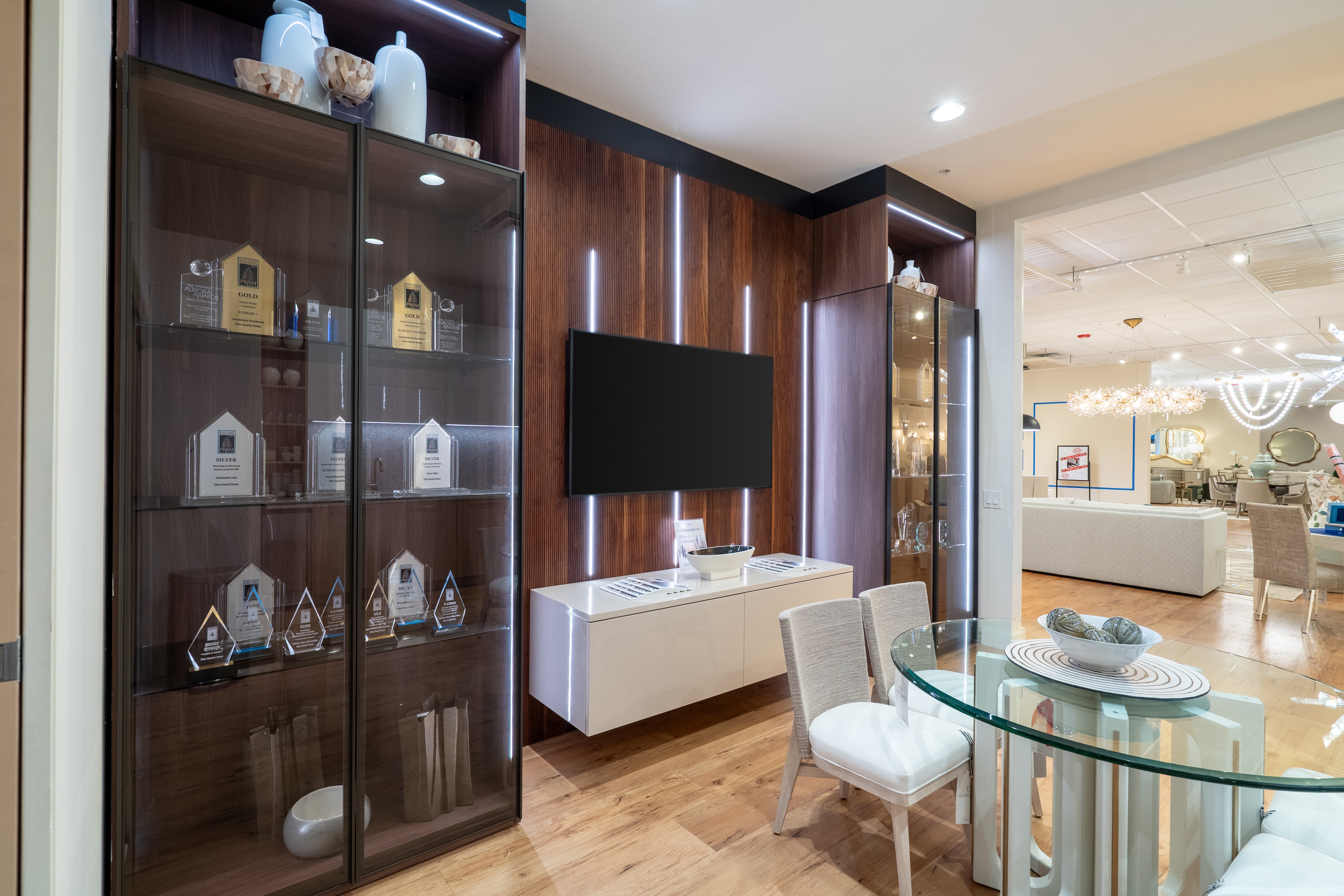 European minimalist media center with built-in shelving and concealed storage drawers