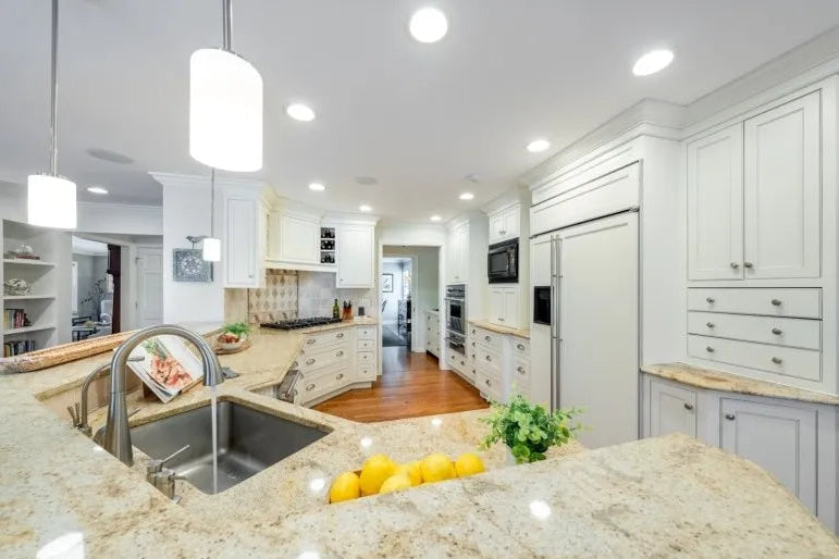 Plain & Fancy custom white kitchen cabinetry with integrated appliances