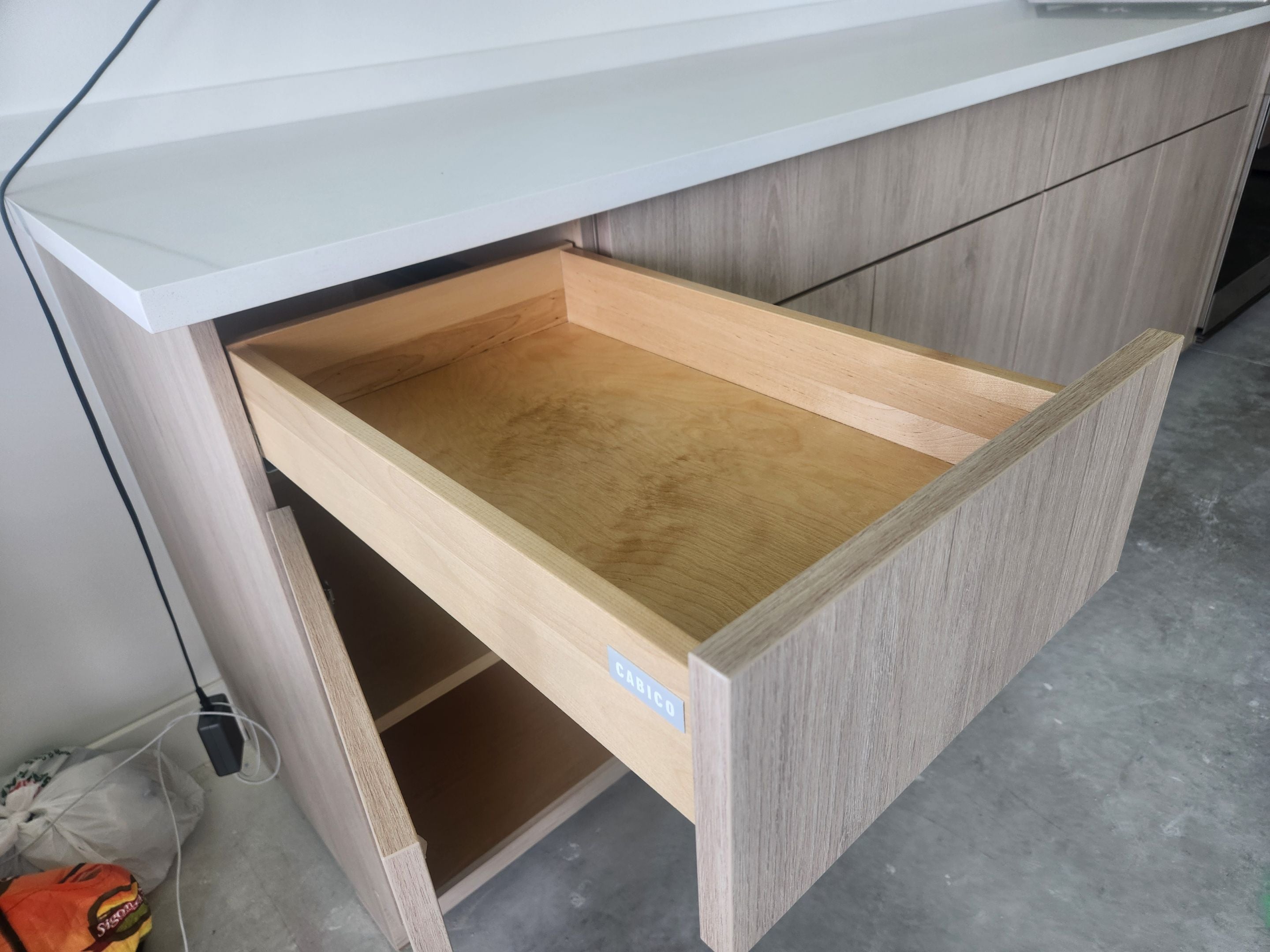 Cabico Sandy Oak Transitional Kitchen with Island & Wolf Appliances