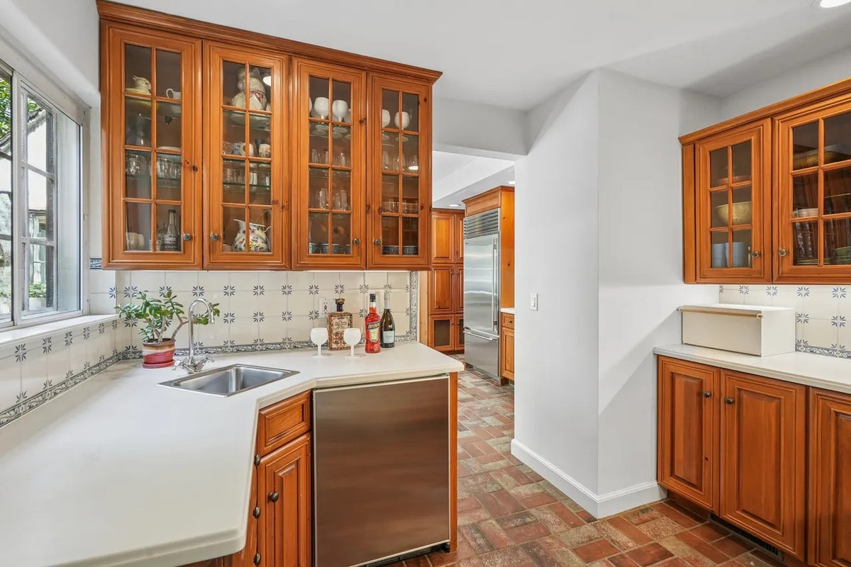 Wood-Mode traditional classic craftsman butler's pantry with sink and faucet