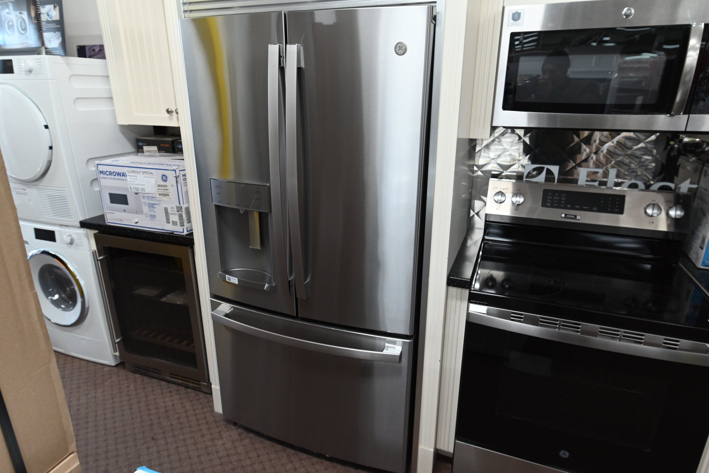 GE GYE22GYNFS 22.1 cu ft counter-depth French door refrigerator in fingerprint resistant stainless steel with water dispenser