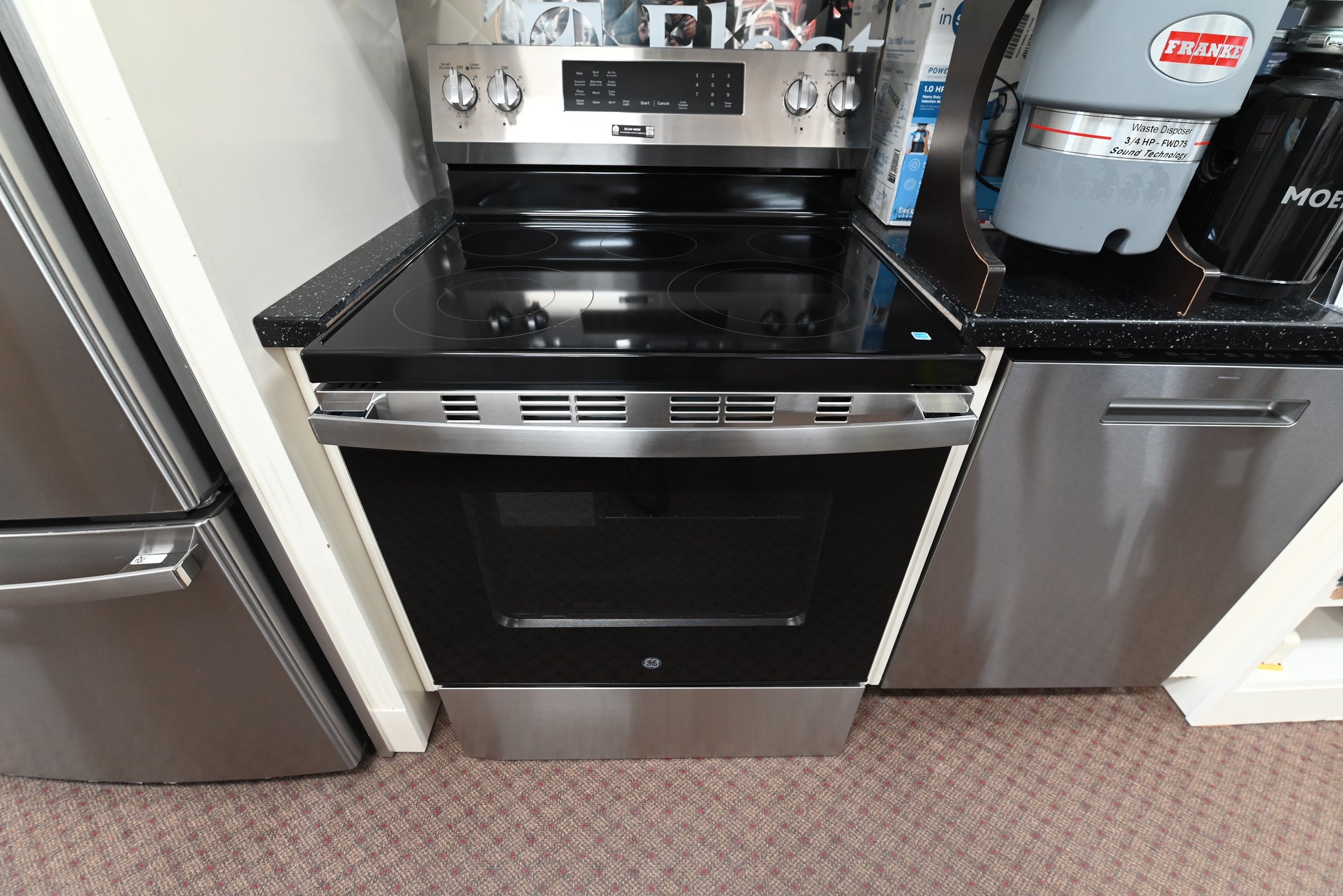 GE GRF600AVSS 30 inch freestanding electric range in stainless steel with front glass oven window and a rear control console