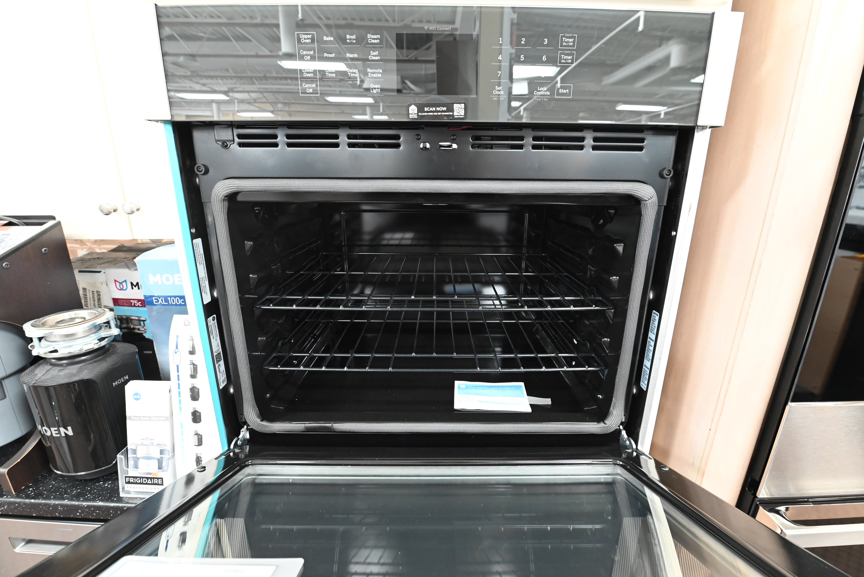 Interior view of the dual 5 cubic foot oven cavities and heavy duty racks of the GE JTD3000SNSS double oven