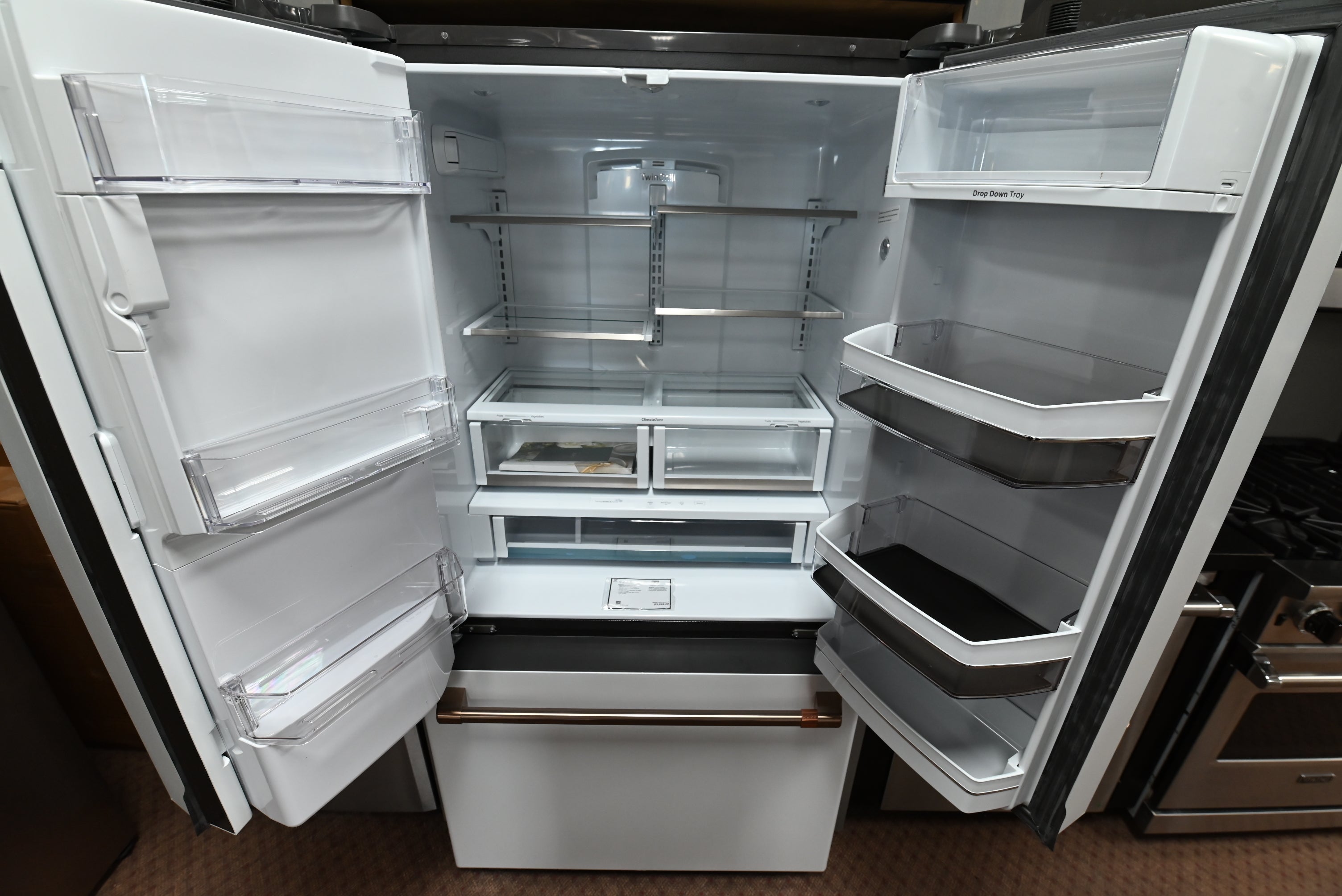 Luxury 36 inch smart counter depth refrigerator with hot water dispenser and brushed bronze handles by Cafe