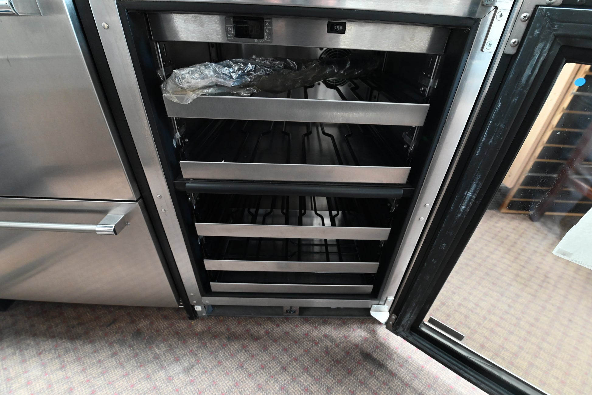 Stainless steel wine cooler with glass door and full-extension shelving
