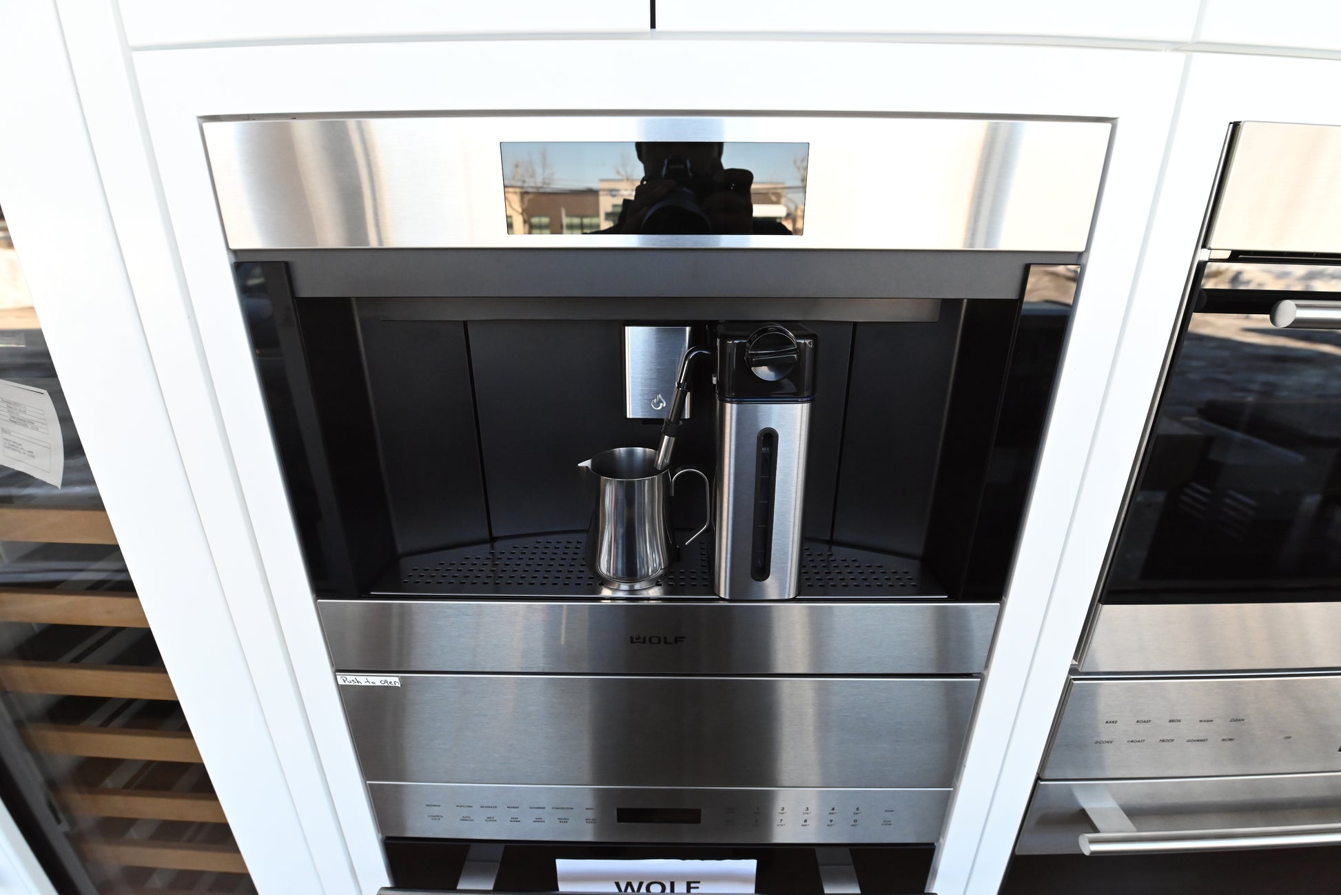 Luxury 24 inch built in espresso machine by Wolf holding integrated milk frothing carafe