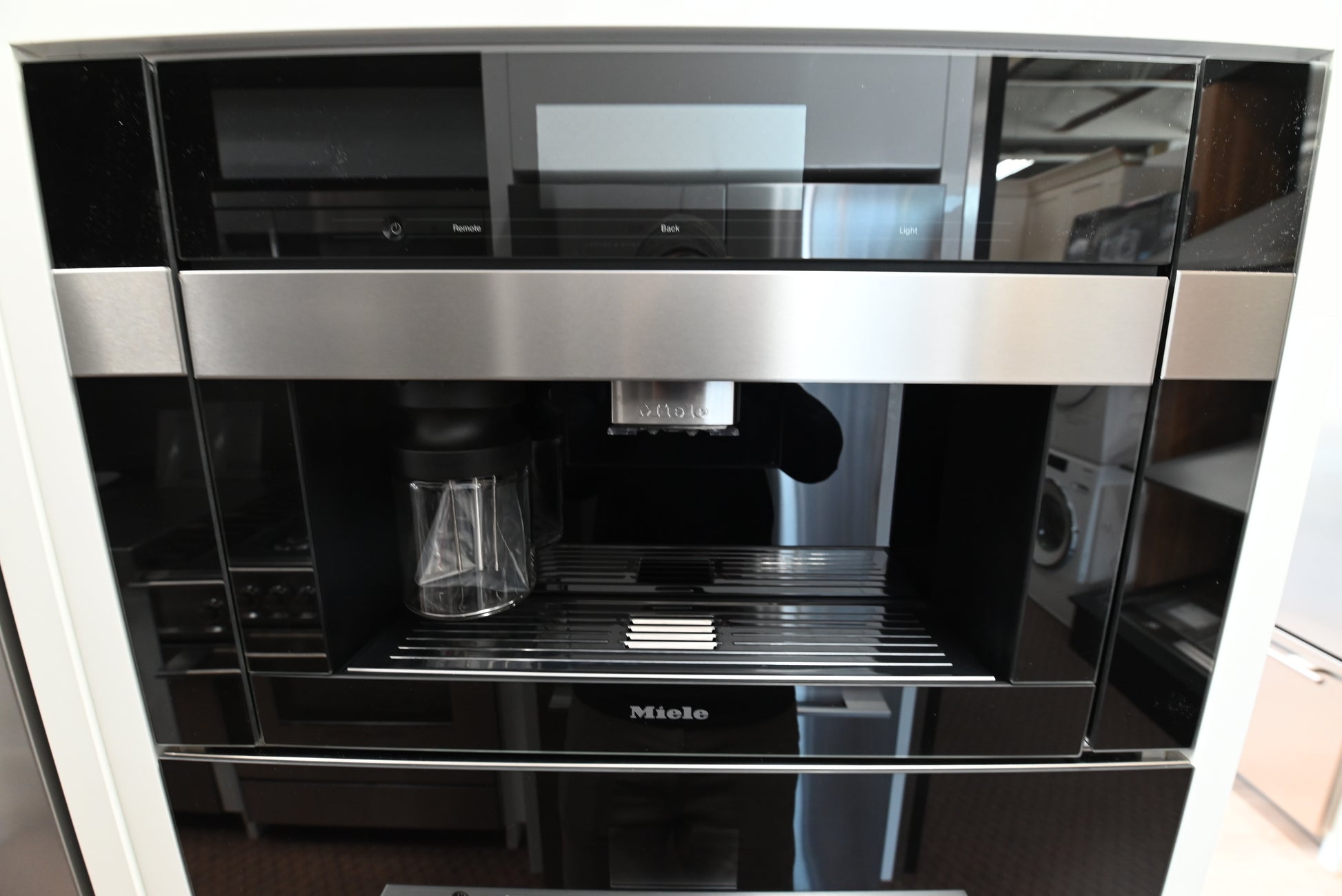 Miele CVA 7845 24 inch built in plumbed coffee machine front view in clean touch steel