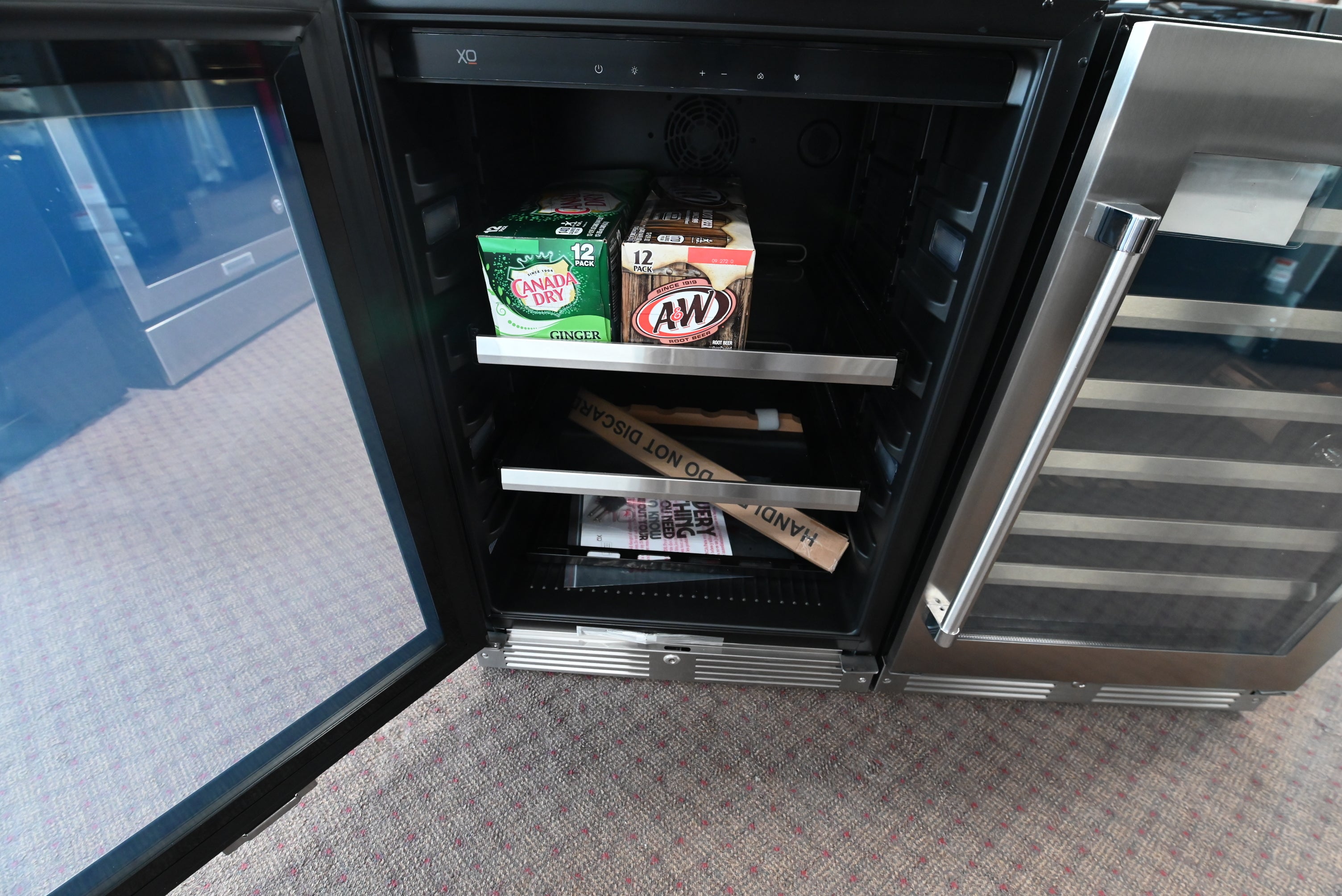 XO undercounter beverage refrigerator with digital touch controls and glass shelves
