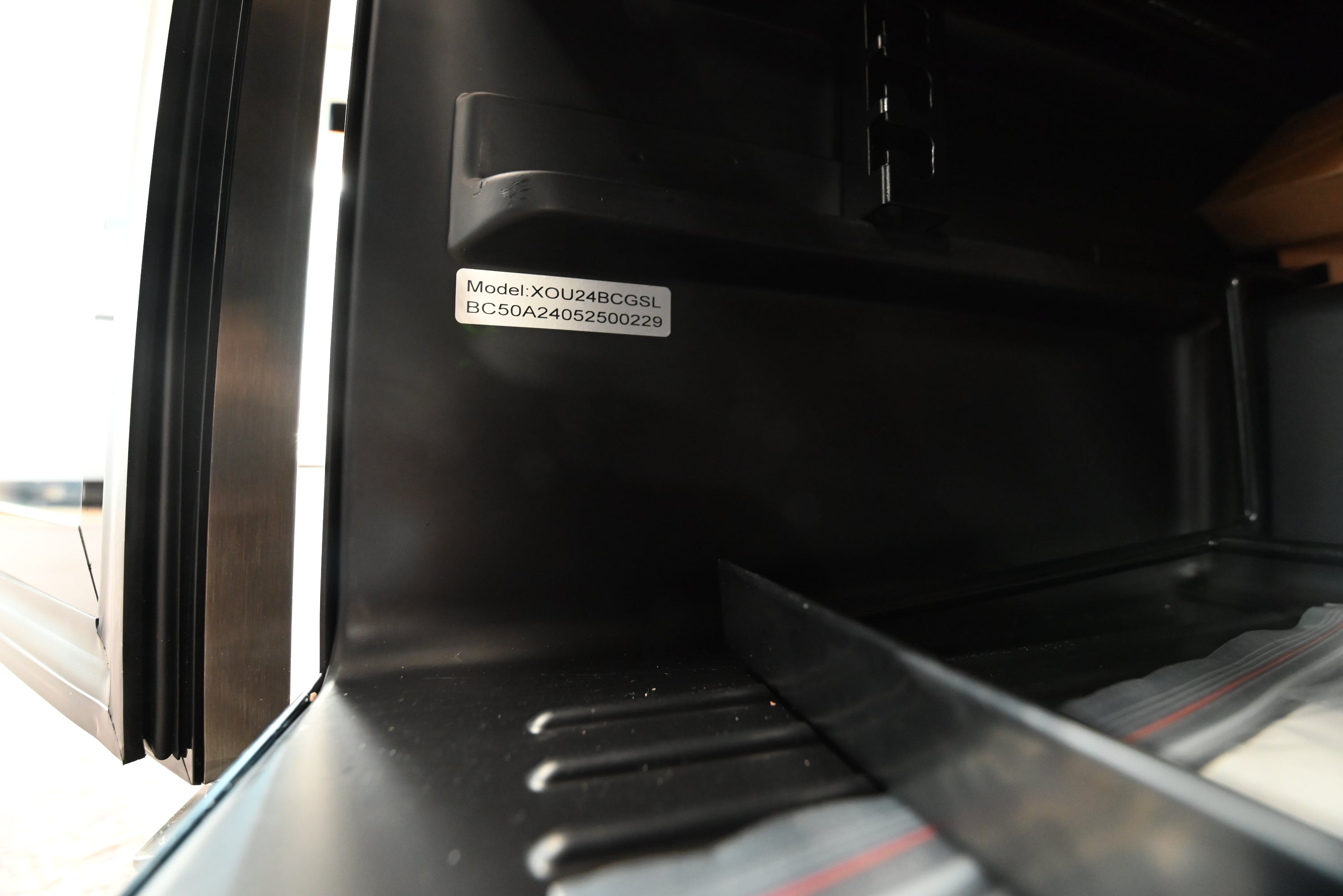 Close up of XO XOU24BCGSL handle and stainless steel exterior finish