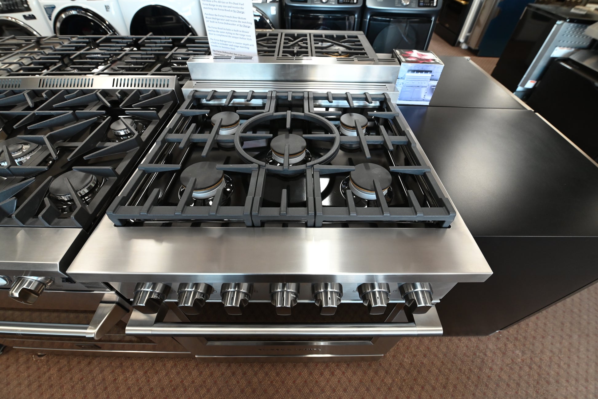 Fisher & Paykel pro-style gas range with continuous cast iron grates and halo dials