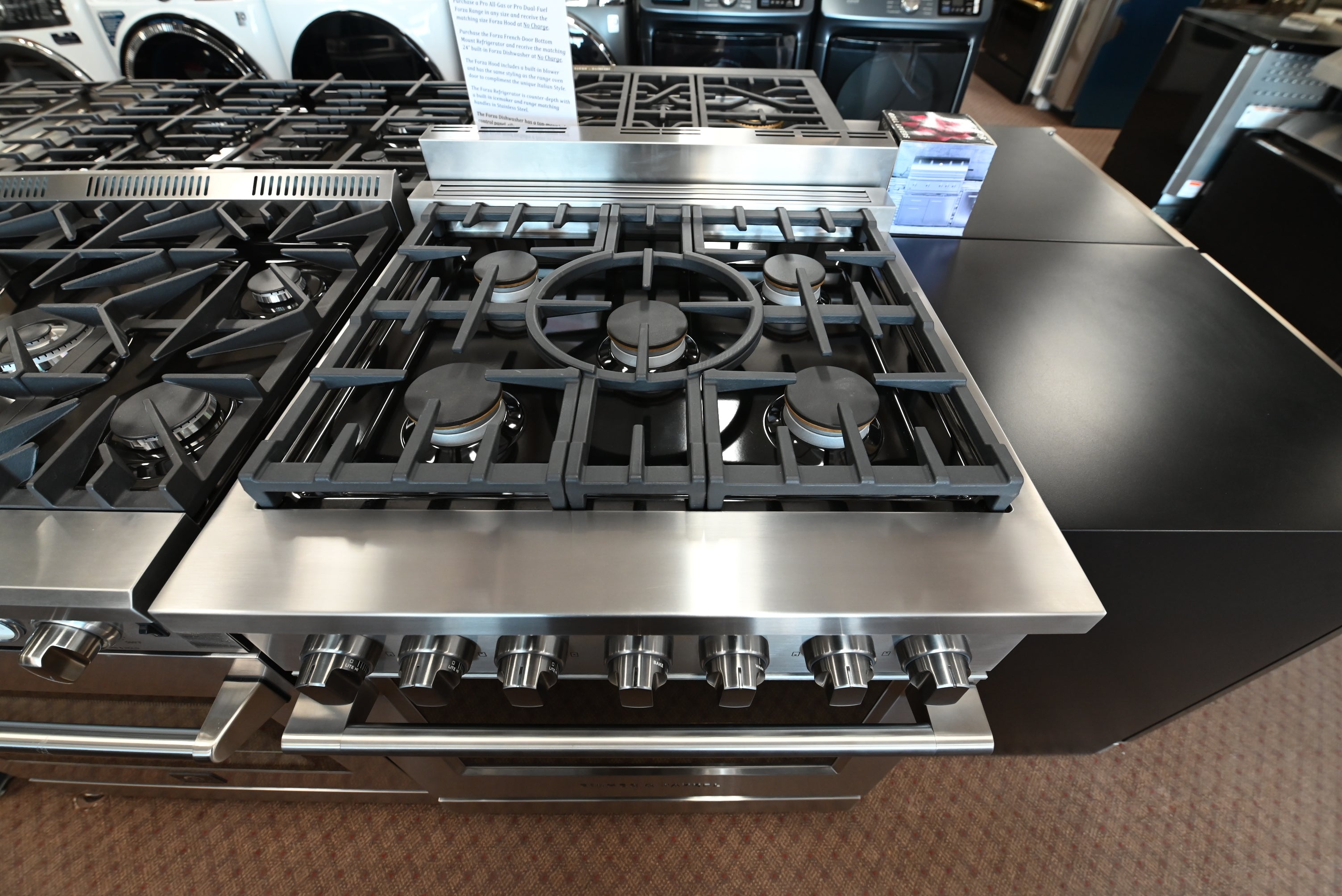 Fisher & Paykel pro-style gas range with continuous cast iron grates and halo dials