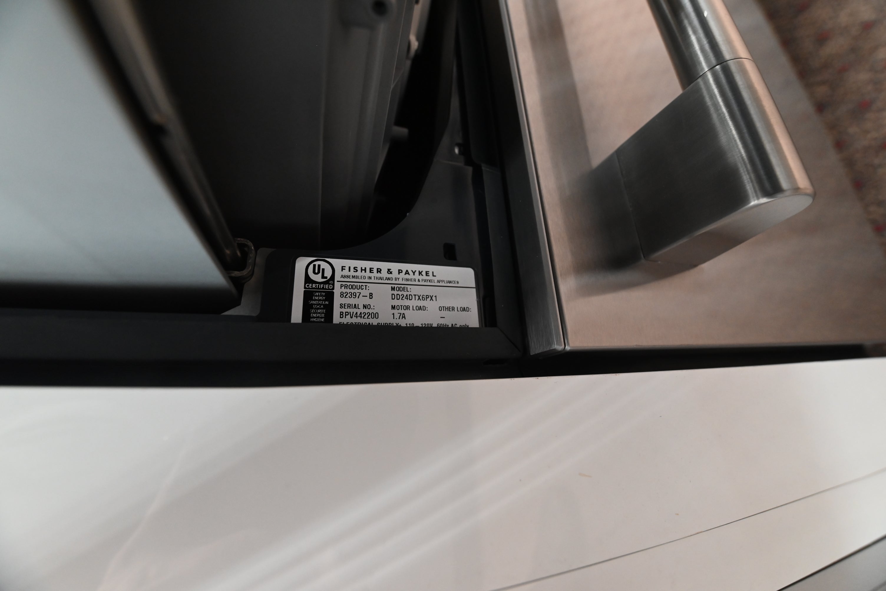 Close up detail of the stainless steel professional handle on the Fisher Paykel Series 11 dishwasher