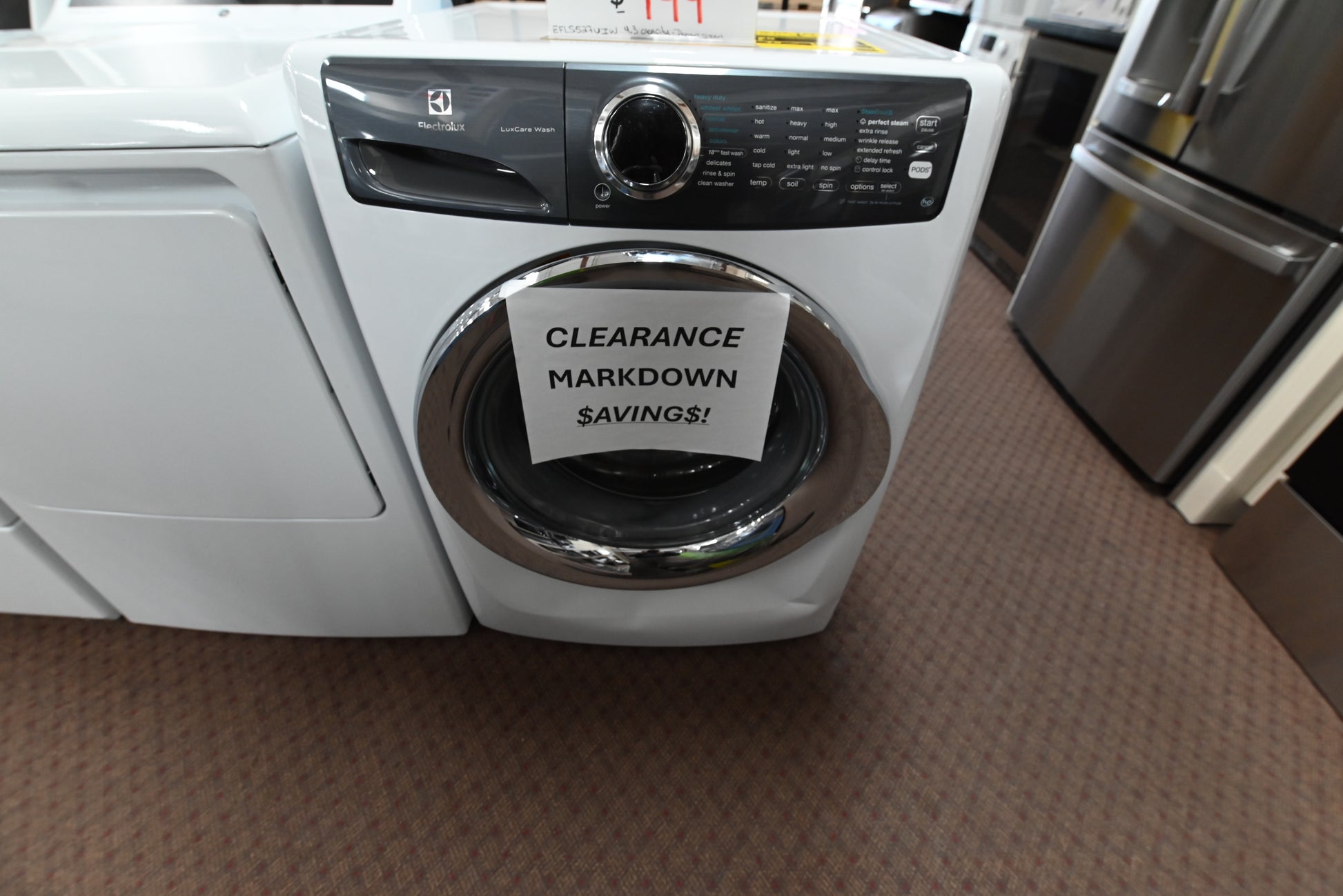 Electrolux 27 inch front load washer in island white with chrome door trim EFLS527UIW